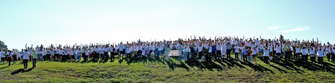 More than 500 participants stop at the top of a park hill, the halfway point of the one-and-a-half-mile charity walk during an event in Jacksonville, N.C., Oct. 2, 2010.  The number of participants more than doubled since last year’s walk.  (U.S. Marine Corps photo by Lance Cpl. Katherine M. Solano)