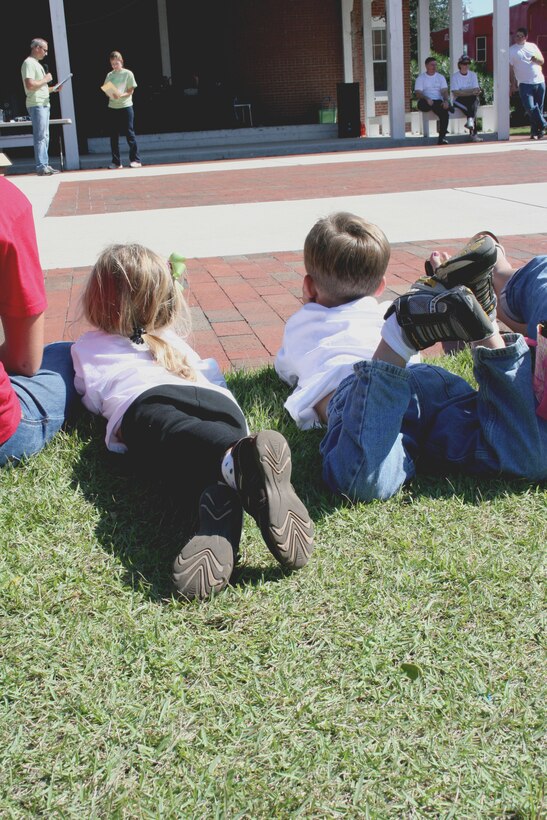 Children lined the stage area after a charity walk in Jacksonville, N.C., Oct. 2, 2010 to await prize announcements.  Prizes were awarded in a variety of categories, including to individuals and teams who raised the most money for the event.