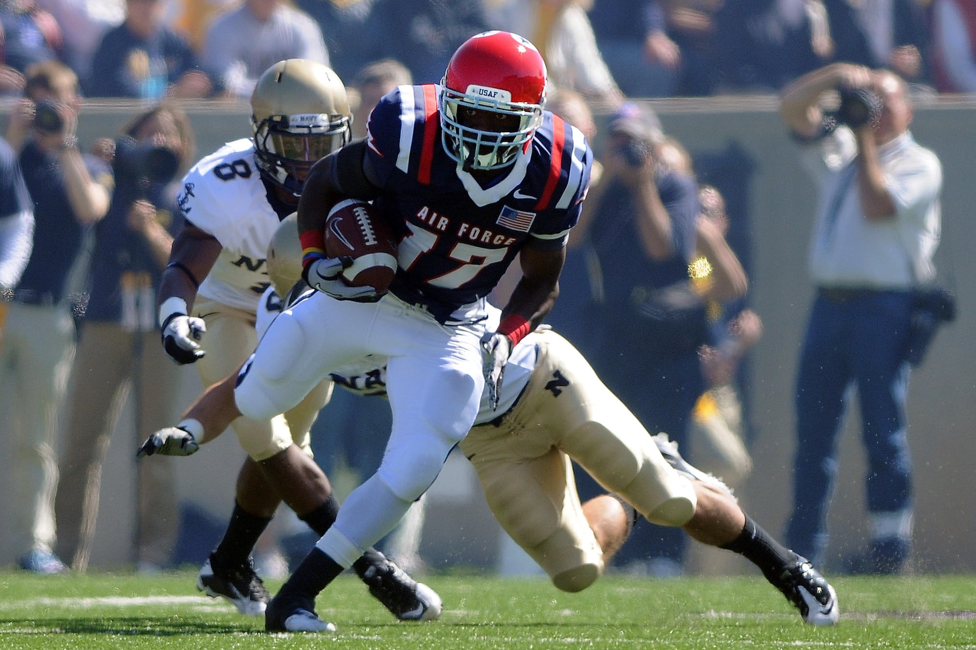 Junior running back Asher Clark breaks a tackle as Air Force defeated Navy 14-6 at the U.S. Air Force Academy's Falcon Stadium in Colorado Springs, Colo., Oct. 2, 2010.    This was the Falcons' first victory over Navy since 2002. (U.S. Air Force photo/Rachel Boettcher)