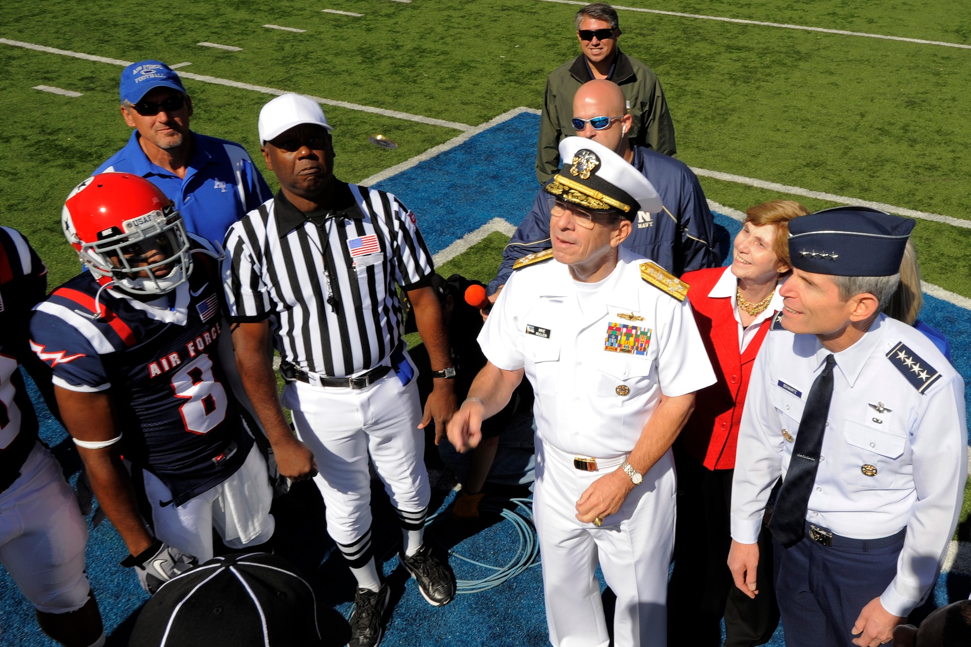 Chairman of the Joint Chiefs of Staff Adm. Mike Mullen and Air Force Chief of Staff Gen. Norton Schwartz participate in the coin toss prior to the start of the Air Force vs. Navy game at the U.S. Air Force Academy's Falcon Stadium in Colorado Springs, Colo., Oct. 2, 2010.  Air Force defeated Navy 14-6.  This was the Falcons' first victory over Navy since 2002. (U.S. Air Force photo/Mike Kaplan) 