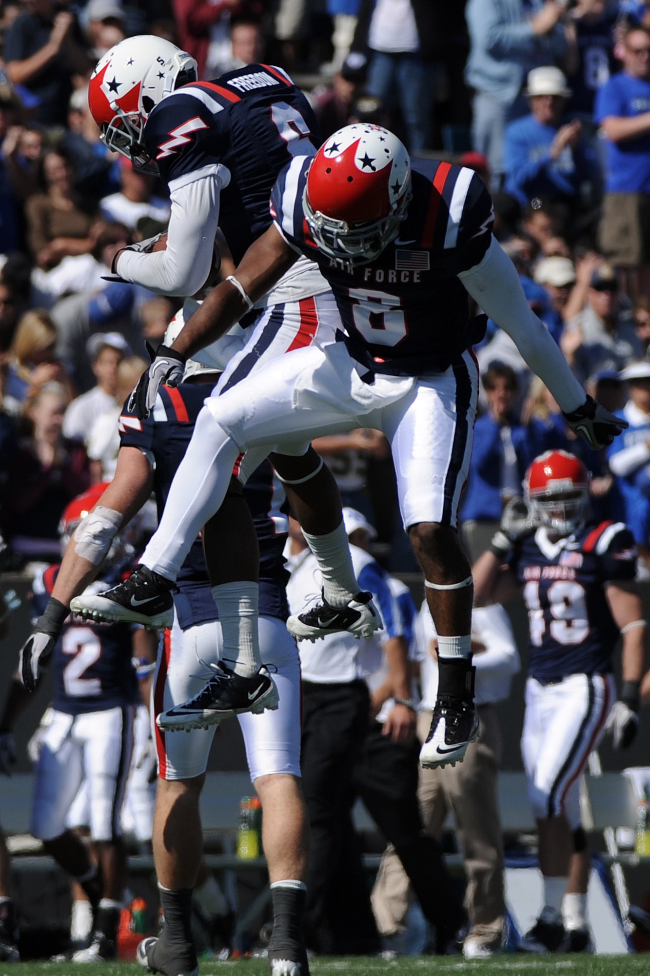 Defensive backs Jon Davis and Reggie Rembert celebrate as Air Force defeated Navy 14-6 at the U.S. Air Force Academy's Falcon Stadium in Colorado Springs, Colo., Oct. 2, 2010.  This was the Falcons' first victory over Navy since 2002.  (U.S. Air Force photo/Johnny Wilson) 