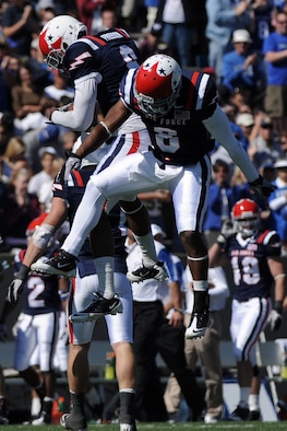 Defensive backs Jon Davis and Reggie Rembert celebrate as Air Force defeated Navy 14-6 at the U.S. Air Force Academy's Falcon Stadium in Colorado Springs, Colo., Oct. 2, 2010.  This was the Falcons' first victory over Navy since 2002.  (U.S. Air Force photo/Johnny Wilson) 