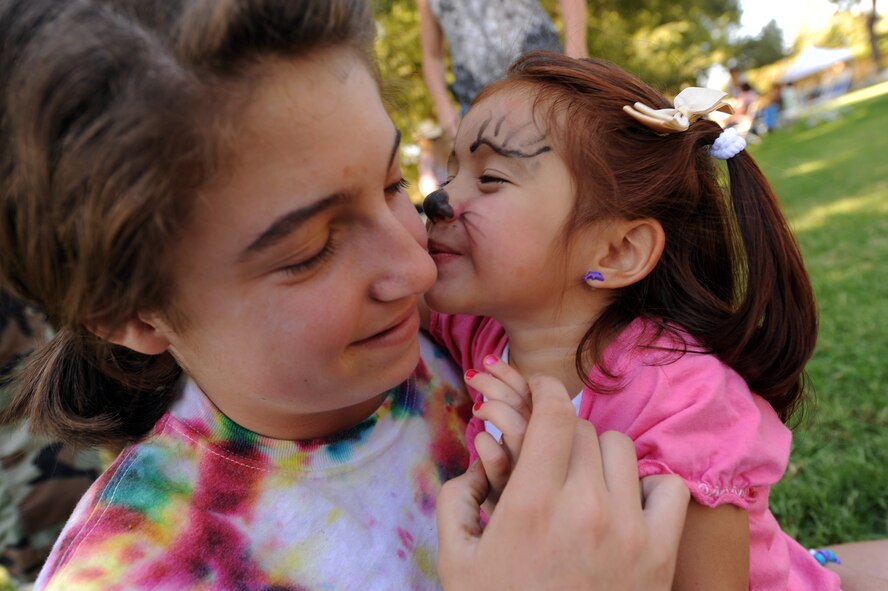 Daughters of U.S. Air Force reservists play during the 38th Annual Military Appreciation Picnic at March Air Reserve Base, Calif. Sept. 18. The two became friends because their parents were in 4th Combat Camera Squadron together. (U.S. Air Force photo by Tech. Sgt. Christine Jones)