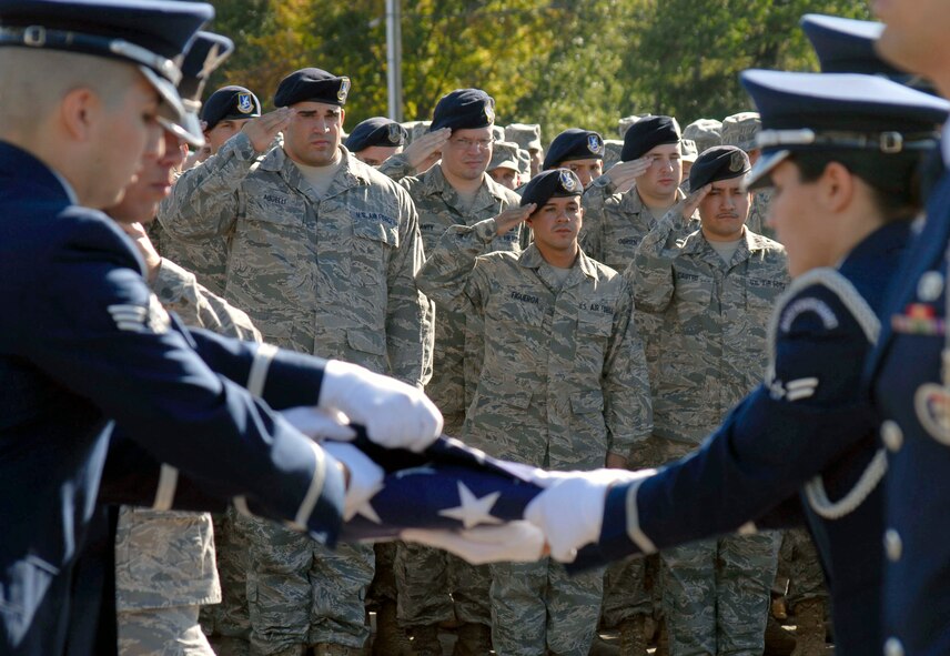 Members of the 103rd Base Honor Guard, Connecticut Air National Guard, finish folding the American Flag  during a Sept. 11, 2010 flag-folding ceremony held at Bradley Air Park, Bradley Air National Guard Base, East Granby, Conn. (U.S. Air Force photo by Tech. Sgt. Joshua Mead)
