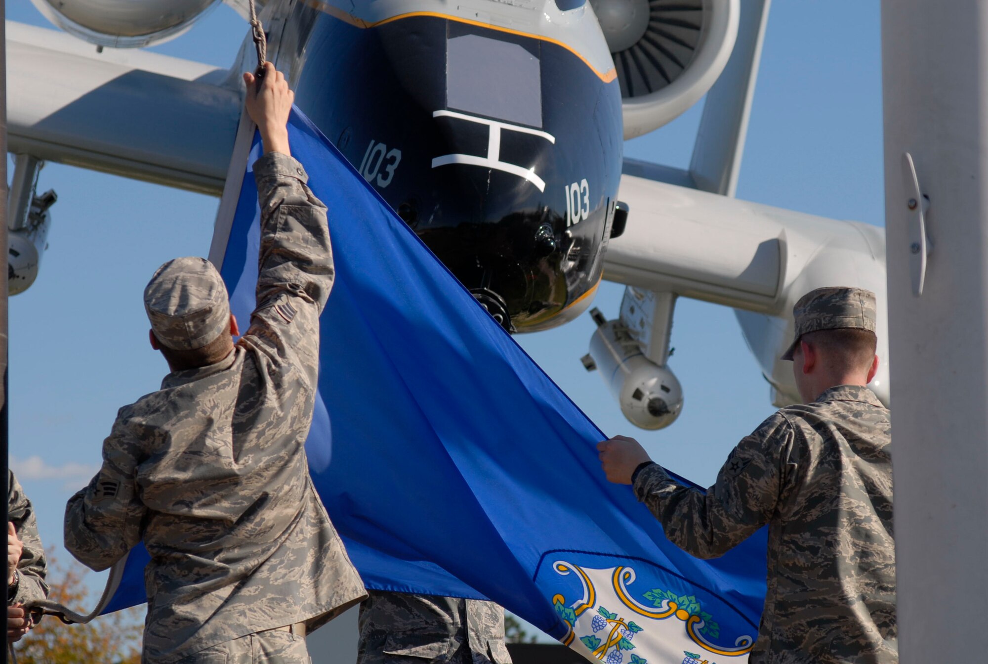 Members of the 103rd Communications Flight retire the Connecticut flag during a special flag-folding ceremony honoring 9/11 fallen and heroes at Bradley Air Park, Bradley Air National Guard Base, East Granby, Conn. Sept. 11, 2010. (U.S. Air Force photo by Tech. Sgt. Joshua Mead)
