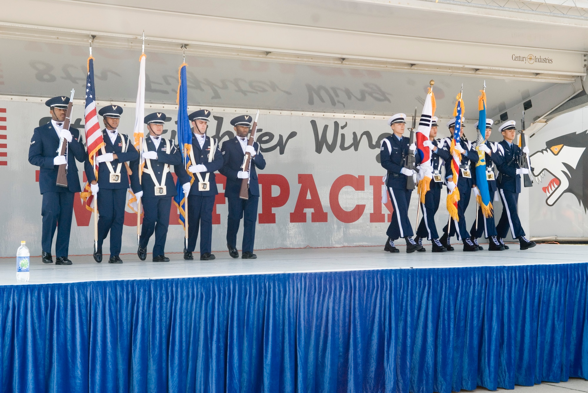 KUNSAN AIR BASE, Republic of Korea -- The 8th Fighter Wing and Republic of Korea Air Force 38th Fighter Group honor guard teams post the colors during the Kunsan Air Base Open House and Gunsan Appreciation Day here Oct. 1, 2010. The base opened its doors to the local community and held events including an F-16 Fighting Falcon fly-by, Korean dance performances, static displays, organizational booths, military working dog demonstrations, aircraft munitions-loading competitions, music and more. (U.S. Air Force photo/Senior Airman Ciara Wymbs)