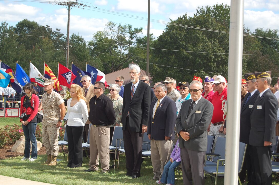 (from left to right) 24th Marines Commanding Officer Col. Gary Johnston, singer Katie Miller, singer Lance Johnson, Kansas City mayor Mark Funkhouser during the Eagle Memorial Dedication ceremony Oct. 2, 2010.