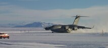 JOINT BASE LEWIS-MCCHORD, Wash. -- A McChord Field-based C-17 lands on the ice at McMurdo Station, Antarctica during Operation Deep Freeze 2009.  Twelve Reservists from here are currently deployed to Christchurch, New Zealand in support of ODF and the National Science Foundation. (U.S. Air Force photo/Chief Master Sgt. James Masura)