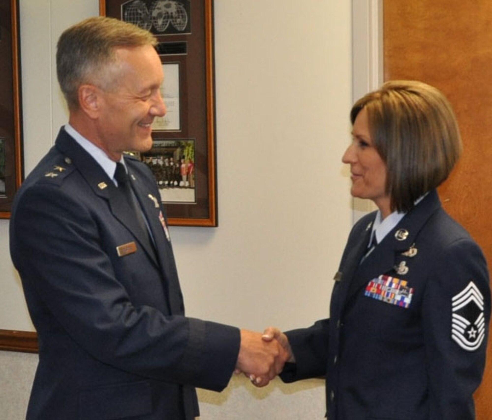 JOINT BASE LEWIS-MCCHORD, Wash. - Maj. Gen. Eric Crabtree, 4th Air Force commander, congratulates Chief Master Sgt. Jeanmarie Kautzman on her retirement here Oct. 2.  General Crabtree is the former 446th Airlift Wing commander. (U.S. Air Force Photo/Staff Sgt. Javier Cruz)