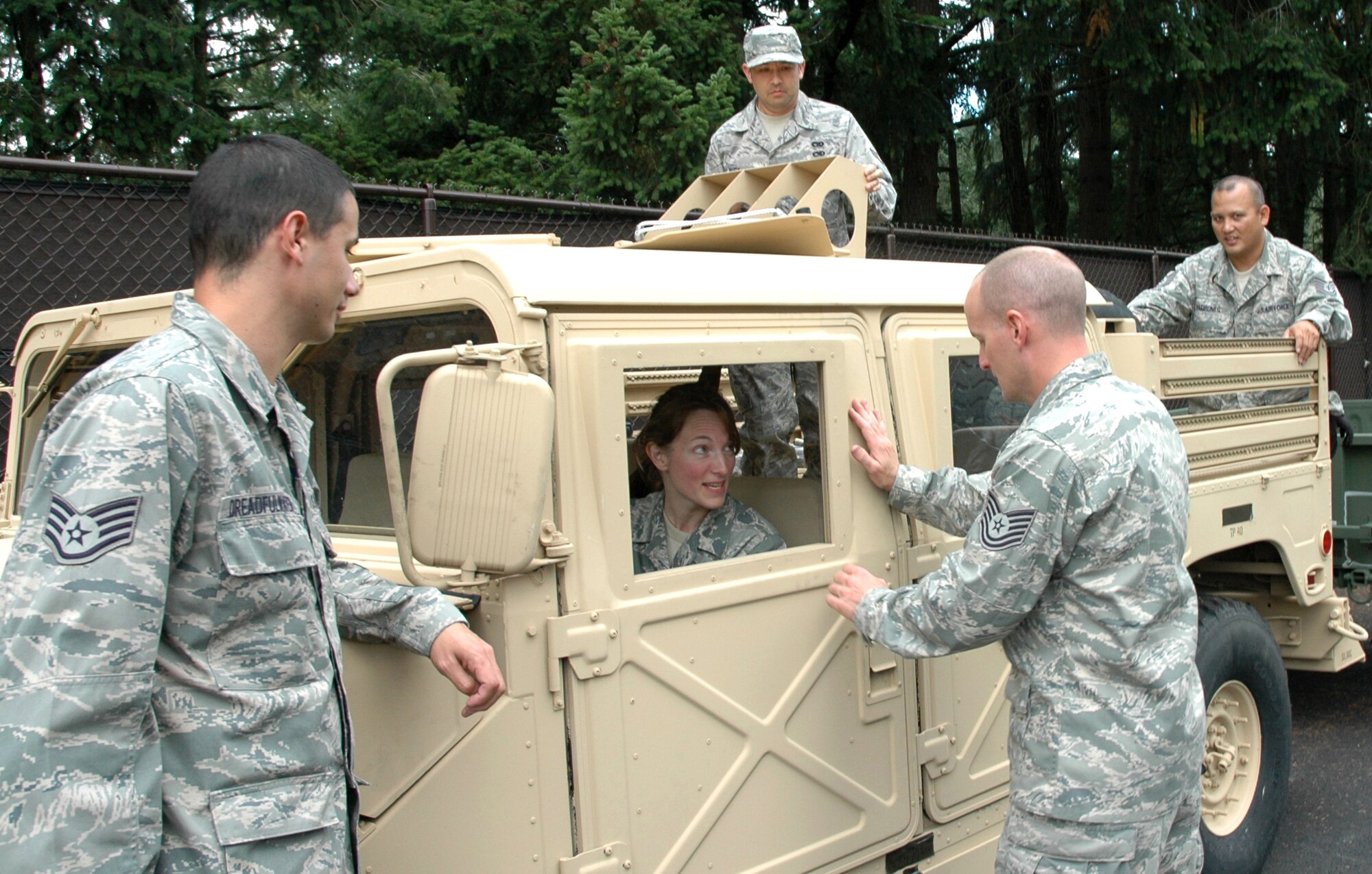 JOINT BASE LEWIS-MCCHORD, Wash.- 36th Aerial Port Squadron members, from left to right, Staff Sgt. David Dreadfulwater, left, Tech. Sgt. Lanisha Metz, Senior Airman James Rudy, Tech. Sgt. Norman Padrones and Tech. Sgt. Jeremy Burlingame, build camaraderie and hone their skills, in preparation for Port Dawg Challenge at Dobbins Air Reserve Base, Marietta, Ga., Oct. 24-29. The 446th Airlift Wing team said it is eager to find out what they can improve on and what are common trends among aerial port units in the Air Force Reserve Command. The Reservists are five of the six-member aerial port team that will compete against 22 other teams in the three-day AFRC sponsored event.  (U.S. Air Force Photo/Staff Sgt. Nicole Celestine)
