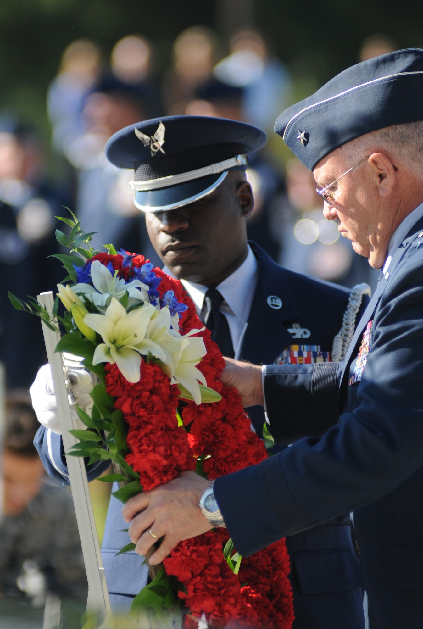 Charlotte, N.C. – Brig. Gen. Iwan Clontz (right) and Chief Master Sgt. Maurice Williams of move a wreath into position during the memorial service honoring North Carolina Air National Guardsmen deceased within the last year. (NCANG photo by Tech. Sgt. Brian E. Christiansen)
