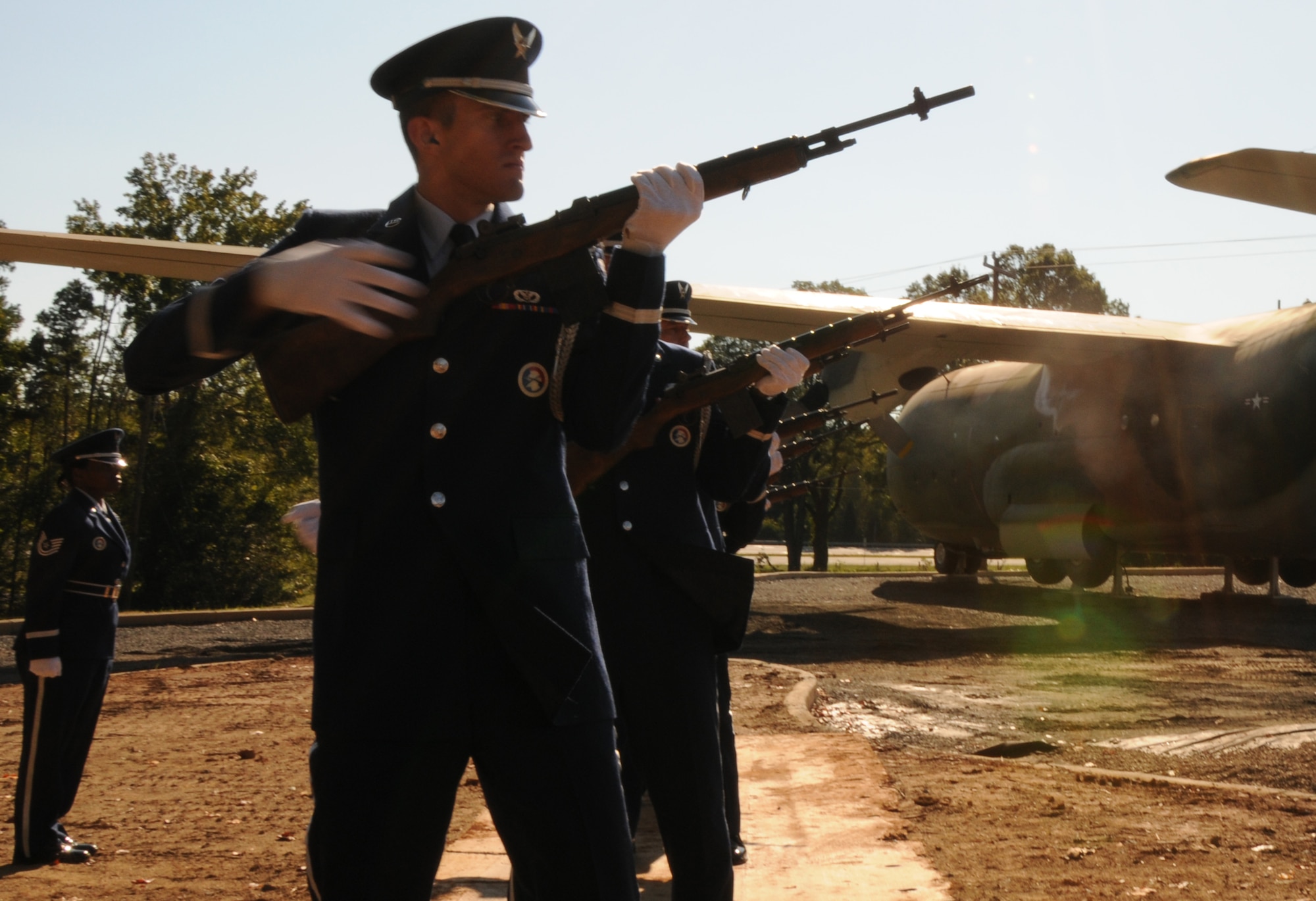Charlotte, N.C. -- Senior Airman Jonathan Boseman of the 145 Airlift Wing Honor Guard fires his rifle as part of the twenty-one gun salute at the memorial service honoring North Carolin Air National Guardsmen deceased within the last year. (NCANG photo by Tech. Sgt. Rich Kerner)