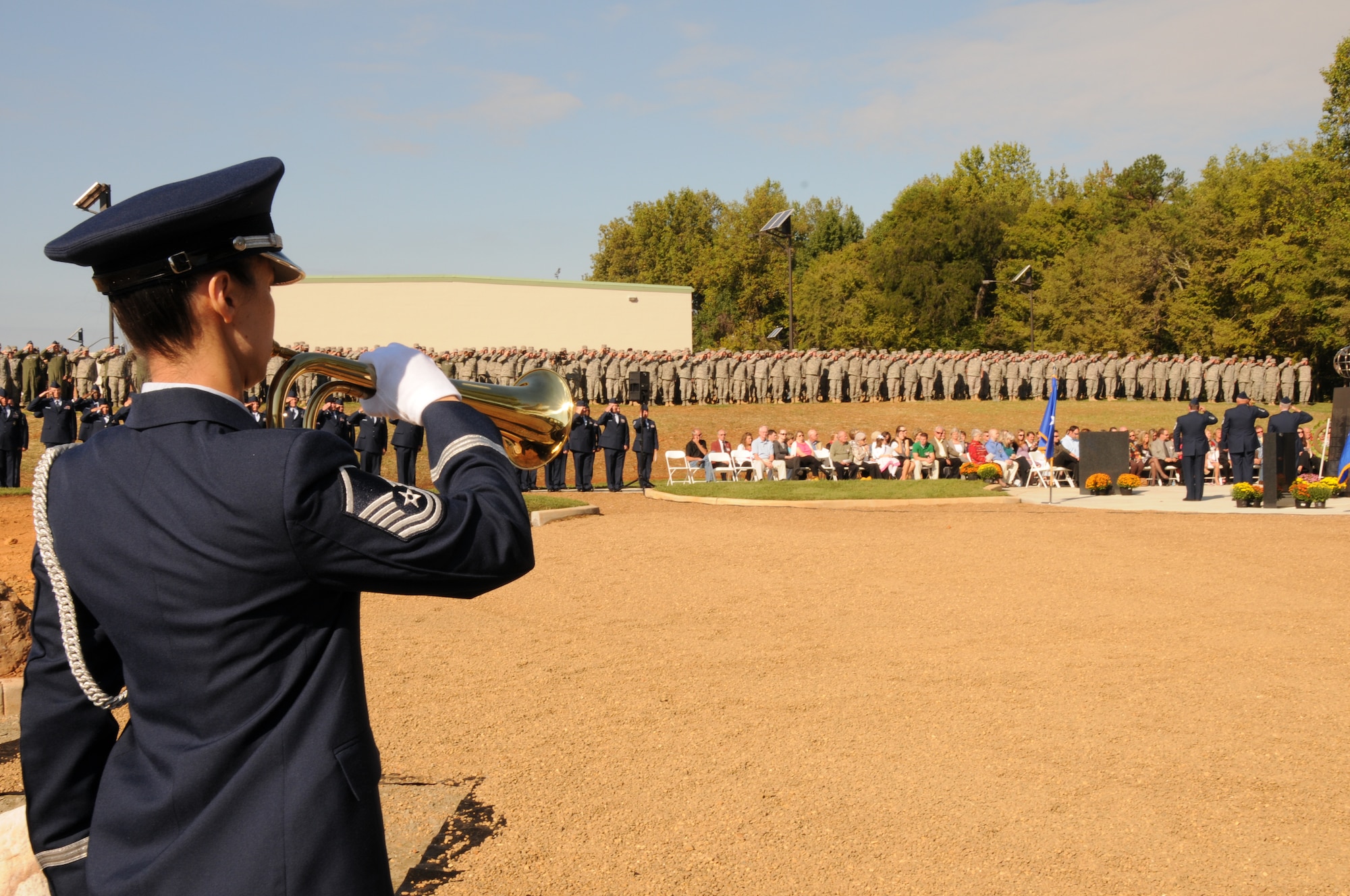 Charlotte, N.C. -- Master Sgt. Lan Dai Hilton of the 145 Airlift Wing Honor Guard plays taps at the memorial service honoring North Carolina Air National Guardsmen deceased in the last year. (NCANG photo by Tech. Sgt. Rich Kerner)