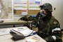 Chief Master Sgt. Barry L. Vance of the 151st Maintenance Squadron works in the Emergency Operations Center (EOC) and gives directions over the phone to local units responding to the Ability to Survive and Operate (ATSO) exercise conducted October 2, 2010. (U.S. Air Force photo by Tech. Sgt. Kelly K. Collett)(RELEASED)