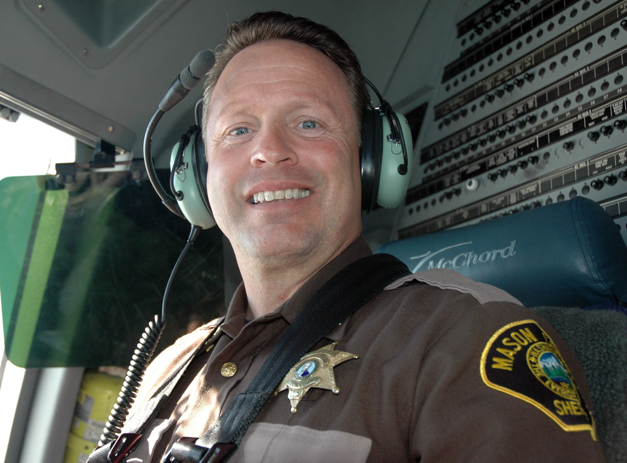 JOINT BASE LEWIS-MCCHORD, Wash.- Mason County Washington Sheriff Casey Salisbury, supervisor of Tech. Sgt. Sean Colpitts, a medic assigned to the 446th Aeromedical Staging Squadron and deputy with Mason County, enjoyed the opportunity to ride the jump seat aboard a C-17 Globemaster III during an orientation flight, Oct. 2. Sheriff Salisbury and many other employers from across the region participated in the bi-annual event hosted by Reservists from the 446th Airlift Wing. (U.S. Air Force photo/Staff Sgt. Elizabeth Moody)