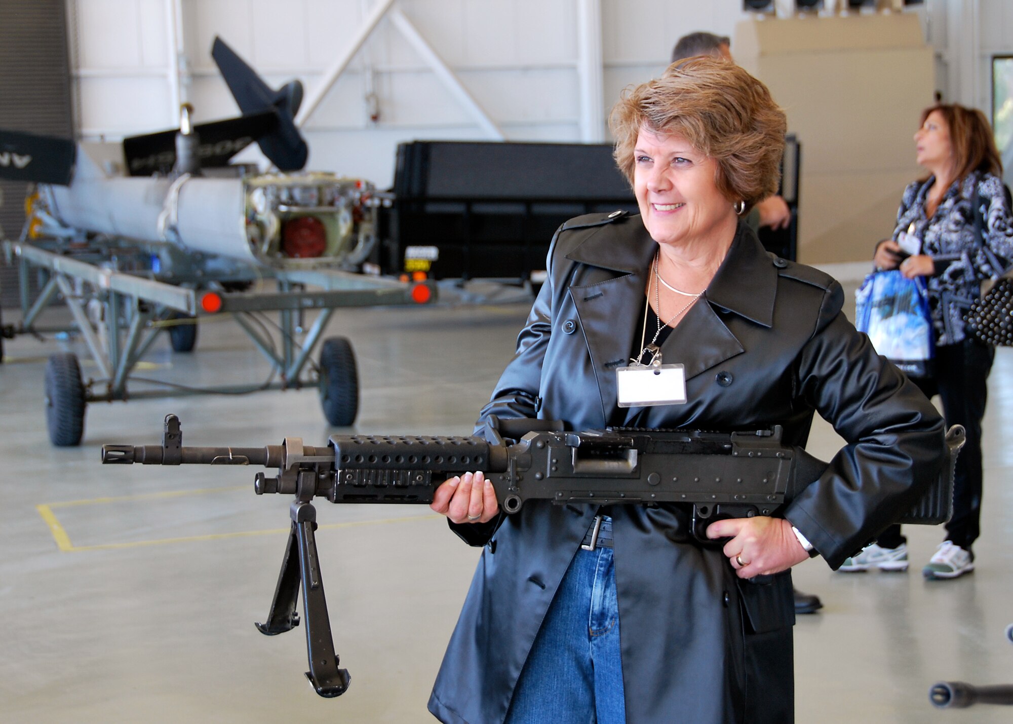 JOINT BASE MCGUIRE-DIX-LAKEHURST, N.J. ? A visitor handles an unloaded M60 machine gun during Employer Appreciation Day here Oct. 2. The employers of Air Force Reserve members were invited to visit the base, fly in either a C-17 Globemaster III or KC-10 Extender and learn about what their employee does while serving in the Reserve. (U.S. Air Force photo/Staff Sgt. Monica Dalberg)