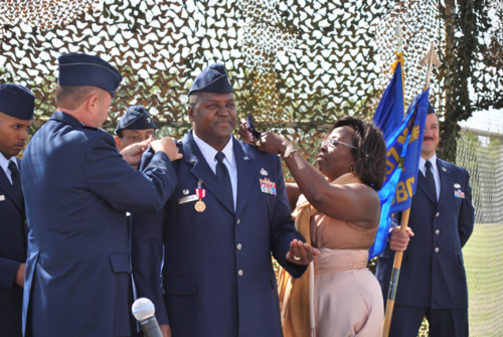 Following the 35th CBCS relinquish of command ceremony Saturday, Oct. 2nd former commander Lt. Col. Pete A. Peterson was promoted to the rank of full colonel. Peterson's wife and Col. Jeffery R. Glass, commander of the 507th ARW pinned the eagles on Peterson.