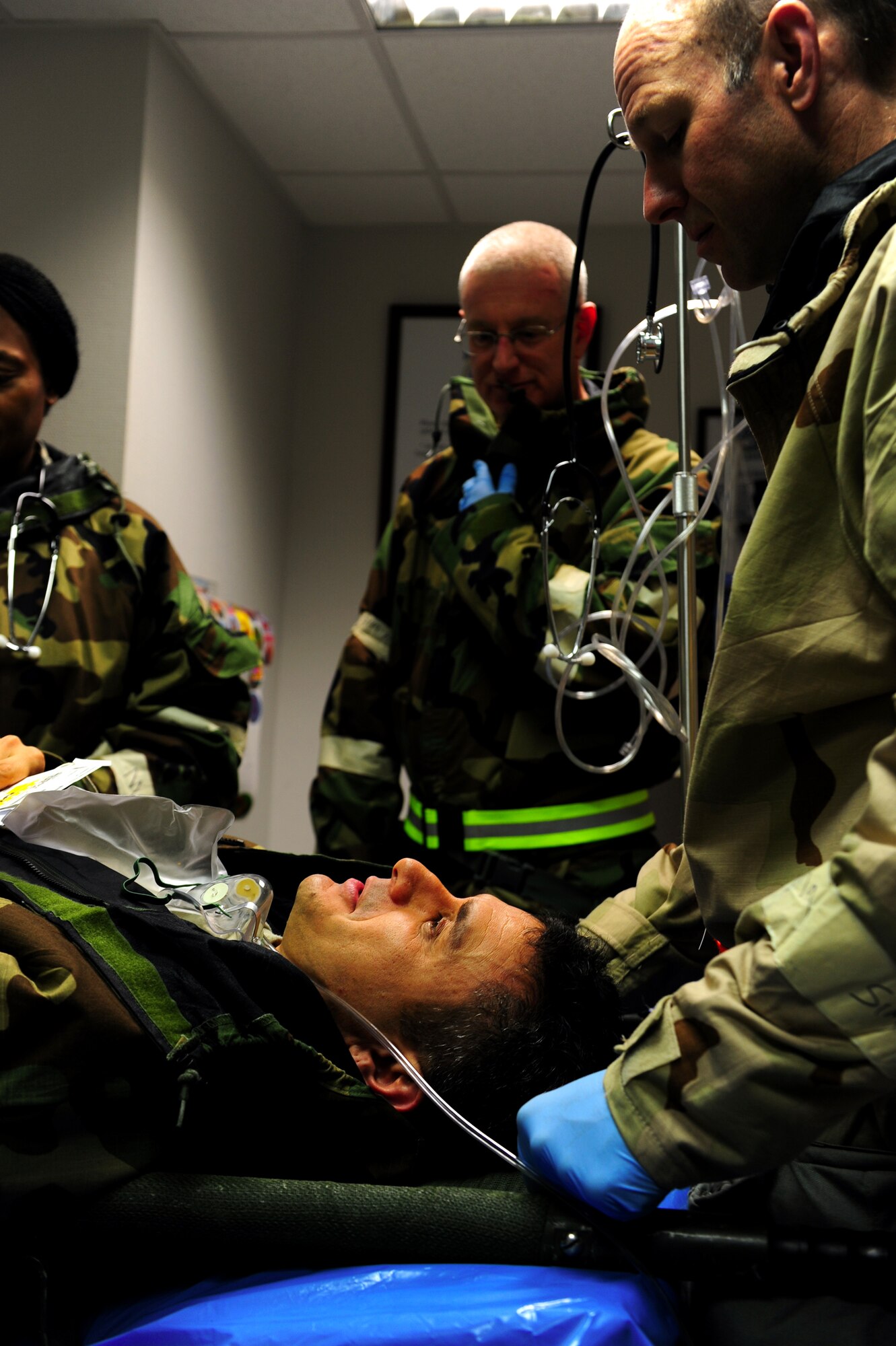 U.S. Air Force Airmen from the 86th Medical Group stabilize a patient during an operational readiness inspection, Ramstein Air Base, Germany, Oct. 3, 2010. The ORI is designed to test Airmen's ability to survive, operate and perform fundamental duties in a war time environment. (U.S. Air Force photo by Airman 1st Class Brea Miller/Released) 