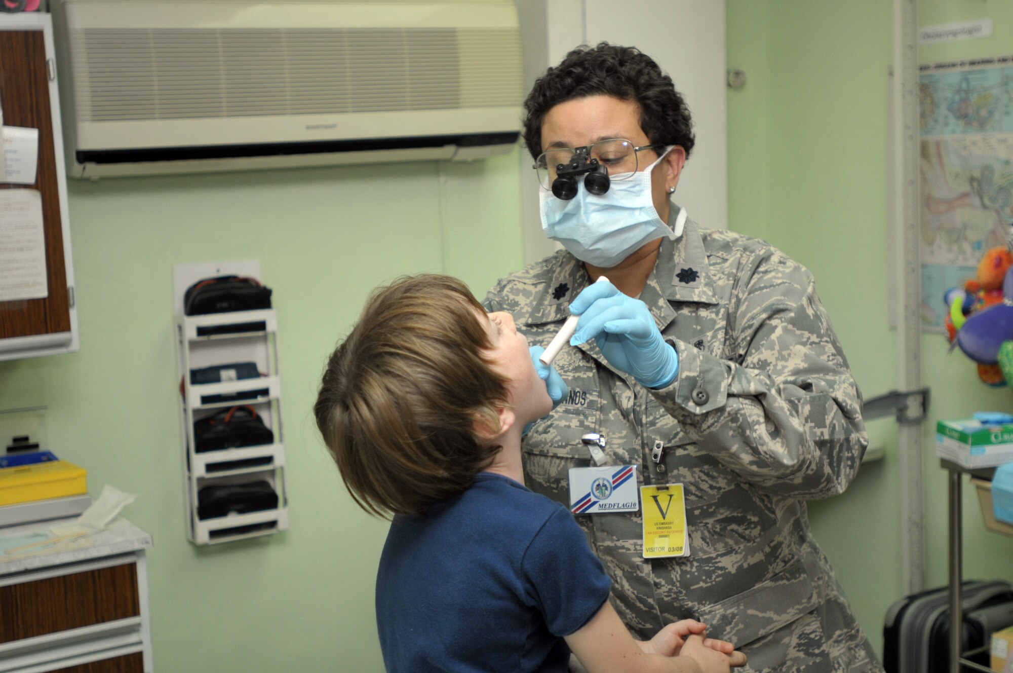 Lt. Col. Jacqueline Garcia- Castellanos, 482nd Aeromedical Dental Squadron, examines a patient at the U.S. Embassy in Kinchasa, Democratic Republic of the Congo, during MEDFLAG 10. MEDFLAG is an annual joint medical training exercise that allows U.S. military servicemembers to work side by side with their African counterparts. “Working with the local population has given us the feeling we are reaching those that really need it,” said Lt. Col. Garcia- Castellanos. (U.S. Army photo/ Sgt. James D. Sims)