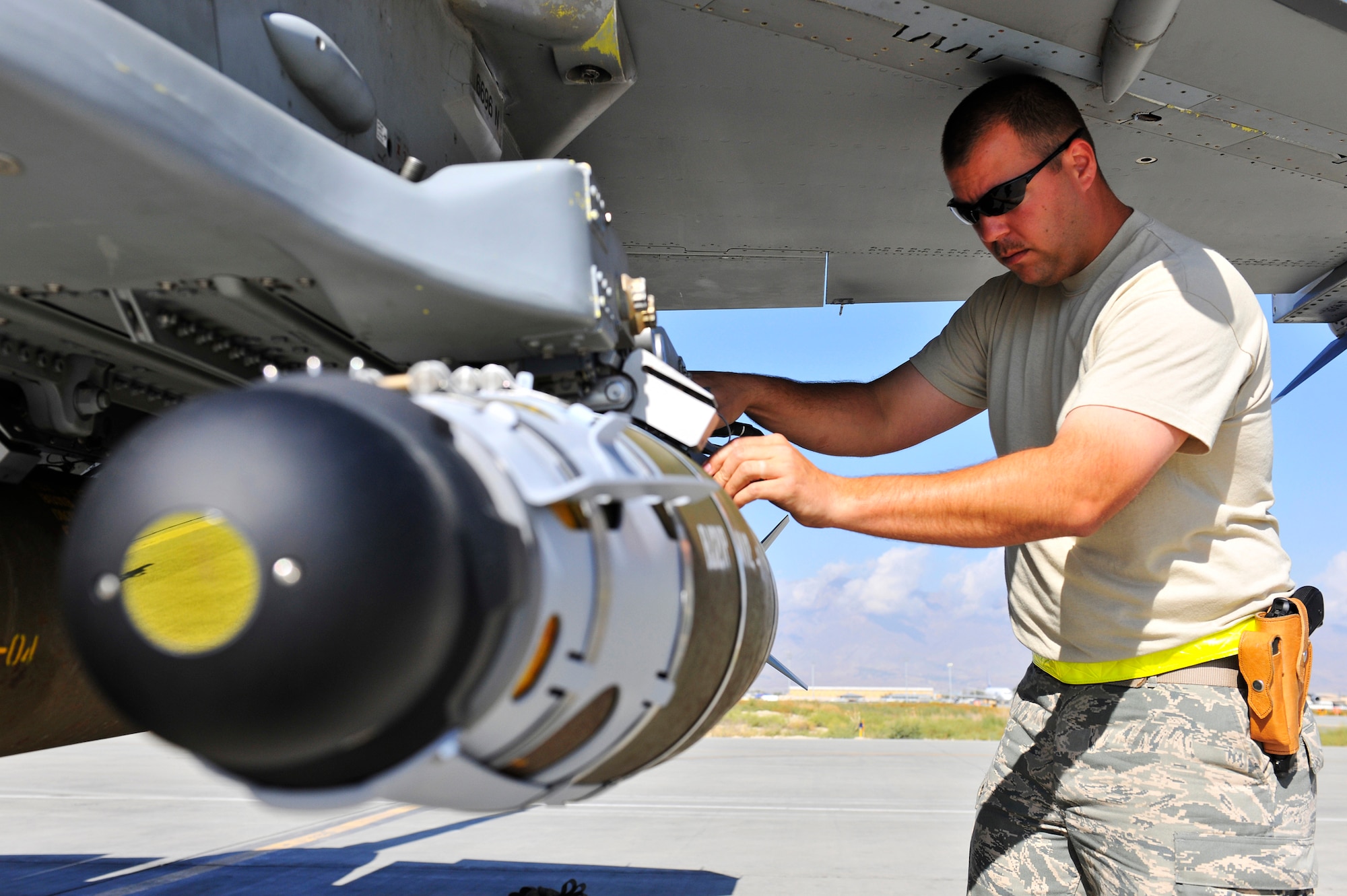 Tech Sgt. Darrin Sather, a weapons expeditor assigned to the 455th Expeditionary Aircraft Maintenance Squadron, performs a supervisory post load on a guided bomb unit-54 loaded on an F-16 at Bagram Airfield, Afghanistan, Sept. 30, 2010. The GBU-54 is the Air Force's newest 500-pound precision weapon, equipped with a special targeting system that uses a combination of Global Position System and laser guidance to accurately engage and destroy moving targets. Sergeant Sather is deployed from Hill Air Force Base, Utah, and is a native of Valley City, N.D. (U.S. Air Force photo/Staff Sgt. Christopher Boitz)