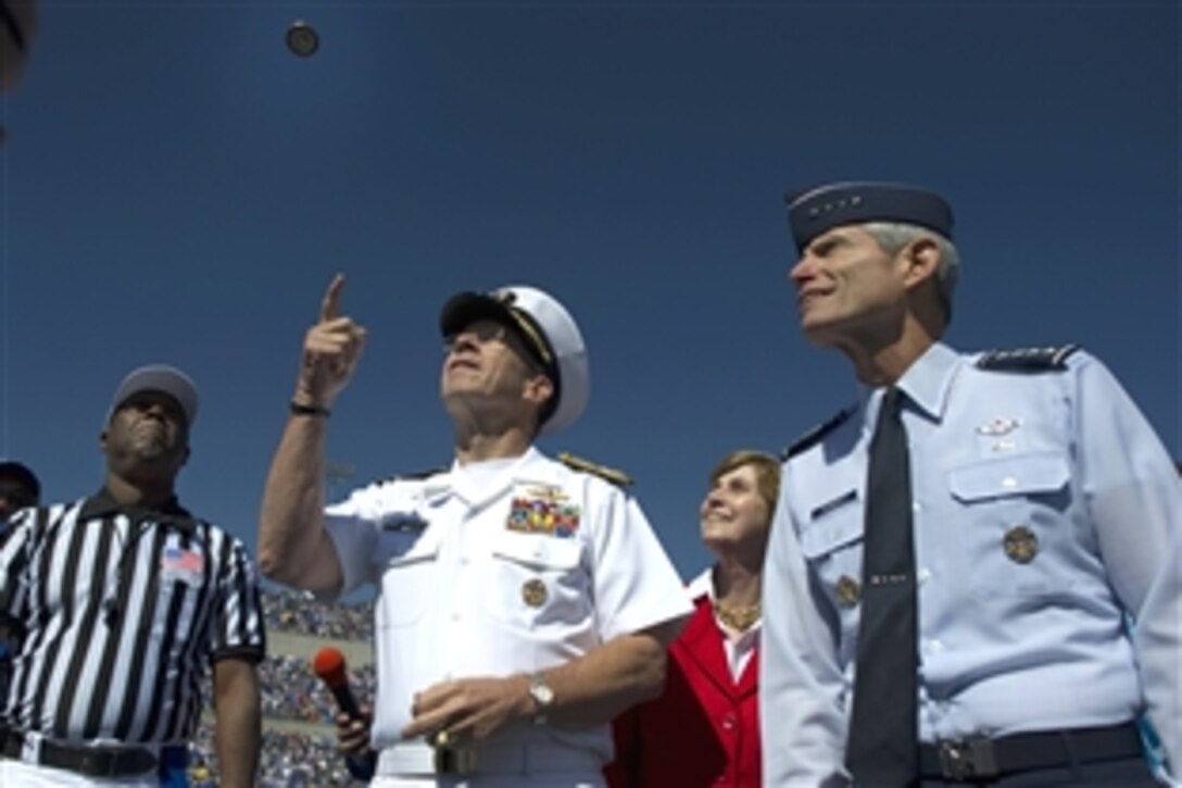Left to right, U.S. Navy Adm. Mike Mullen, chairman of the Joint Chiefs of Staff, Deborah Mullen and U.S. Air Force Chief of Staff Gen. Norton A. Schwartz participate in the coin toss at Falcon Stadium prior to the kickoff of the U.S. Air Force Academy Falcons vs. the U.S. Naval Academy Midshipmen football game in Colorado Springs, Colo., Oct. 2, 2010. The Falcons ended a seven-year drought defeating the Midshipmen 14-6. 