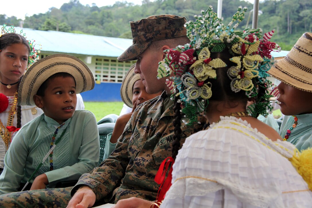 Capt. Michael C. Toth, native of Wyckoff, N.J., and Staff Judge Advocate for Special-Purpose Marine Air-Ground Task Force Continuing Promise 2010, talks to Panamanian children waiting for Panamanian President Ricardo Martinelli to arrive to a medical site in Punta Pena, Oct. 4, 2010. Marines, sailors, soldiers, airmen, civilians and Panamanian citizens attended a presidential visit along with Vice President Juan Carlos Varela; Phyllis M. Powers, U.S. ambassador to Panama; and Franklin Vergara, Panama’s minister of health. CP10 personnel are anchored off the coast of Chiriqui Grande, Panama, to conduct humanitarian operations to the Caribbean, Central and South America.