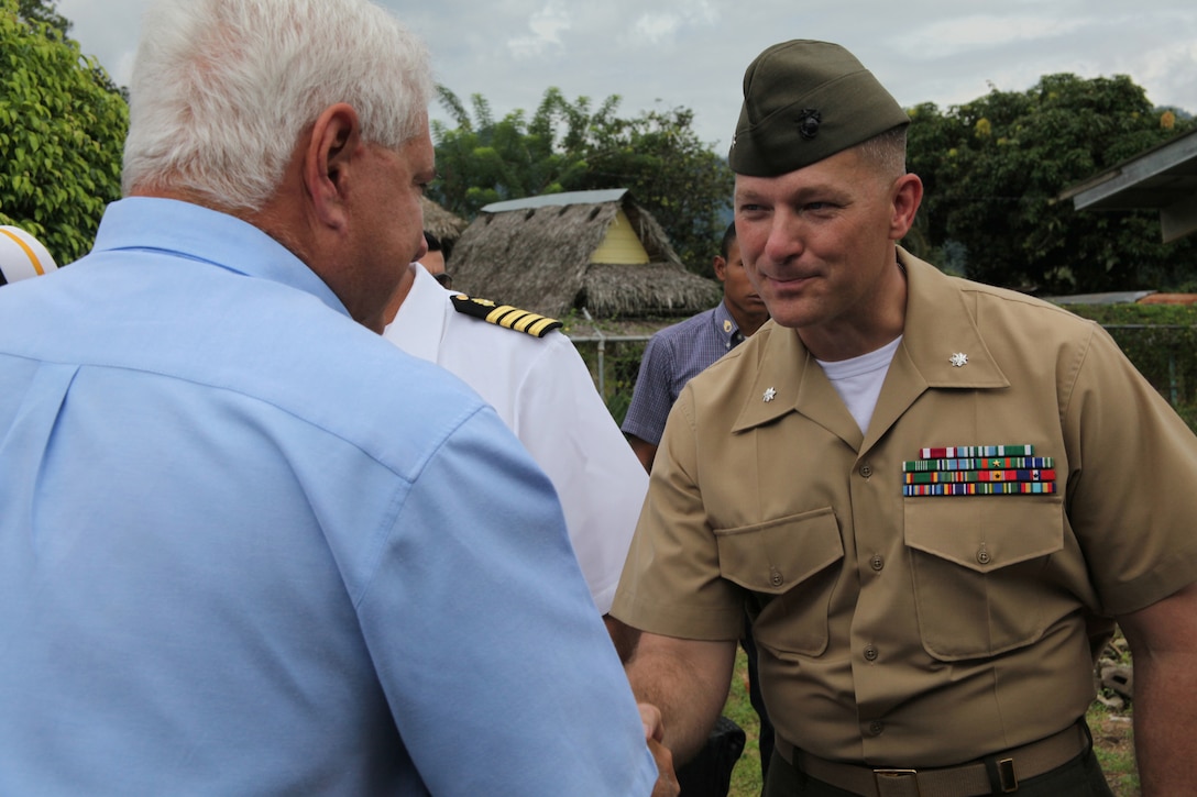 Panamanian President Ricardo Martinelli shakes hands with Lt. Col. Chris S. Richie, commanding officer of Special-Purpose Marine Air-Ground Task Force Continuing Promise 2010, during the president’s visit to a medical site in Punta Pena, Oct. 4. Marines, sailors, soldiers, airmen, civilians and Panamanian citizens attended a presidential visit along with Vice President Juan Carlos Varela; Phyllis M. Powers, U.S. ambassador to Panama; and Franklin Vergara, Panama’s minister of health. CP10 personnel are anchored off the coast of Chiriqui Grande, Panama, to conduct humanitarian operations to the Caribbean, Central and South America.