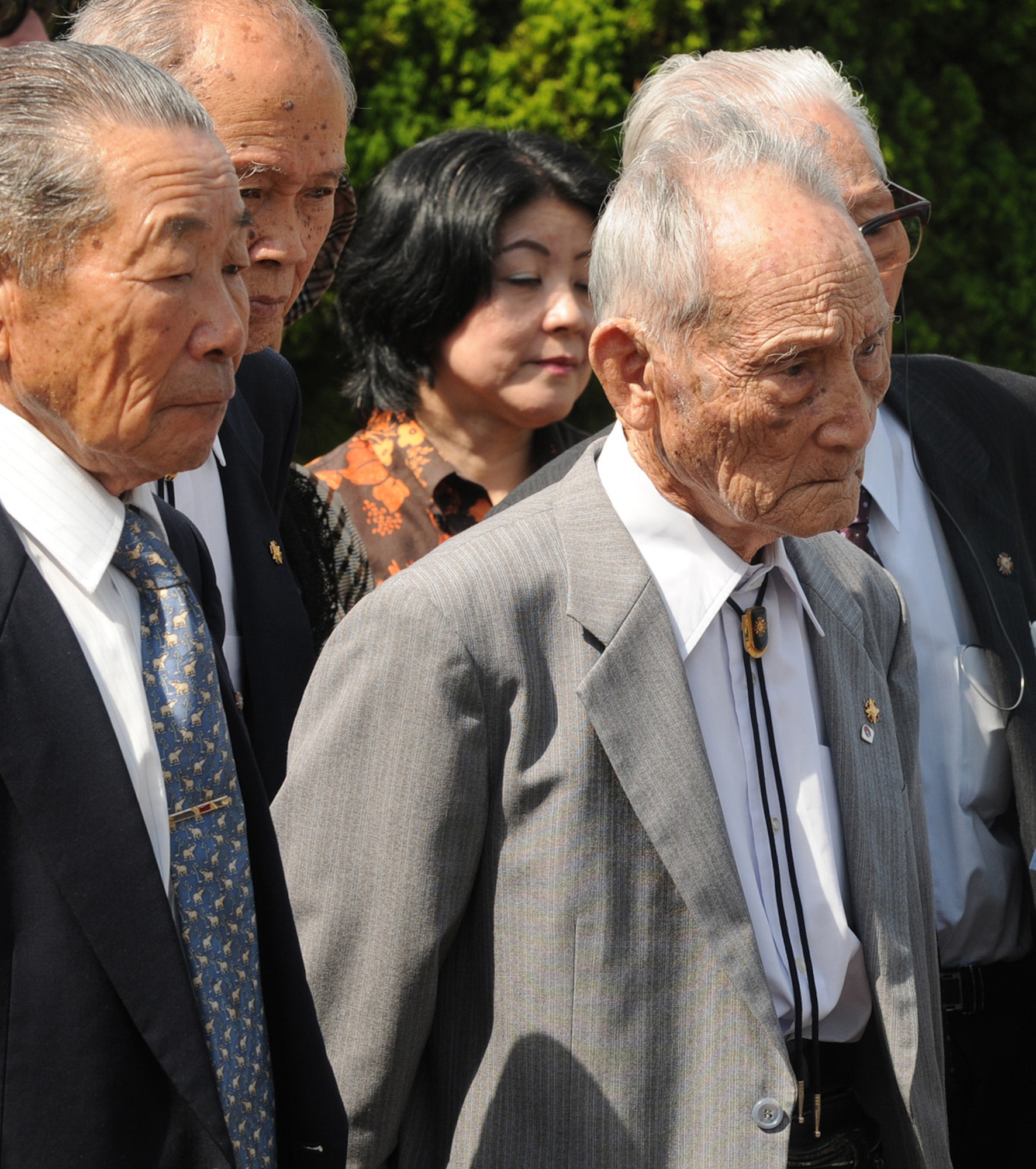 Japanese World War II veterans gaze upon the site where Japan's 10th Army surrendered at the end of the war. Twenty-eight members of the Japan Disabled Veterans Association visited two of Kadena's historic sites Sept. 30. (Right) Shinzou Kaji, 94, from Miyazaki Prefecture was recovering in a field hospital in Burma when he heard his country had surrendered to the United States in August 1945. The former senior NCO in the Japanese Imperial Army said his enemy has become a key ally over time and now the two countries promote peace and stability in Asia. (Air Force/Tech. Sgt. Jason Lake)