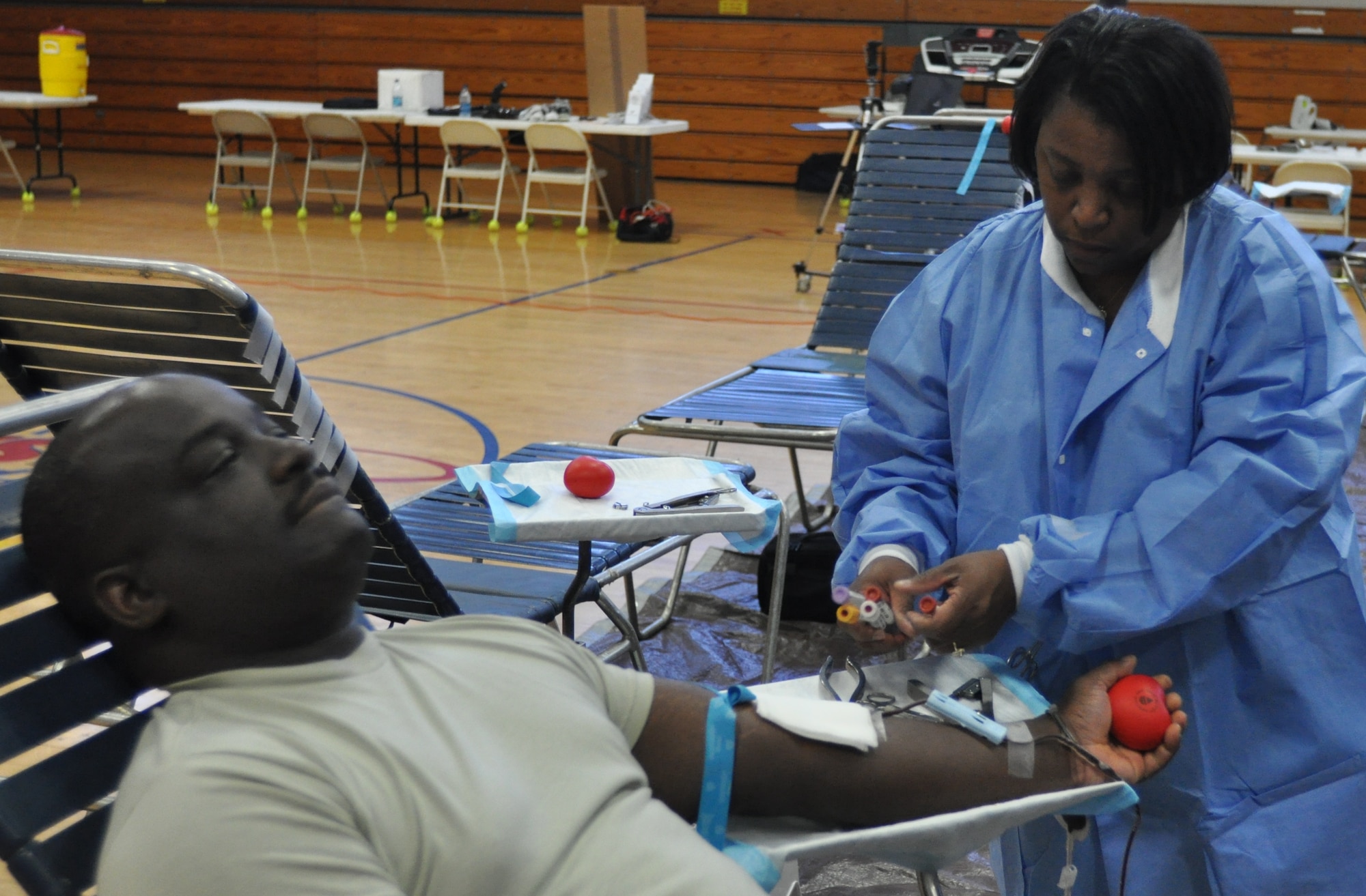 Tech. Sgt. Denis Foster donates blood during the 315th Airlift Wing health and wellness fair Oct. 2, 2010 at the Joint Base Charleston, S.C., Charleston Fitness and Sports Center. Elvia Guyton facilitated the donation process. Sergeant Foster is a fuels technician with the 315th Maintenance Squadron, and Mrs. Guyton is a certified phlebotomist with the Armed Services Blood Program.  (U.S. Air Force photo/Staff Sgt. Shane Ellis)