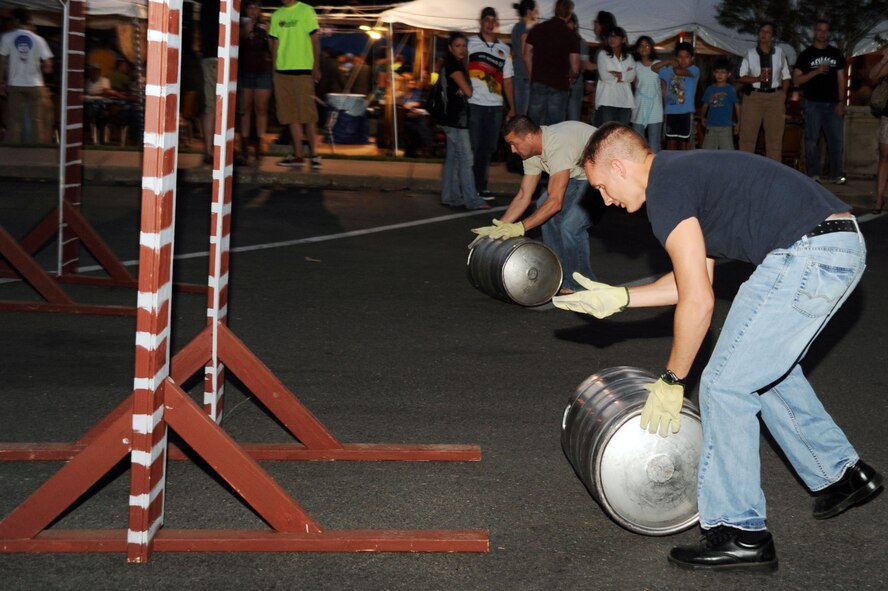 BARKSDALE AIR FORCE BASE, La. -- Barksdale personnel and their families participate in the keg-roll contest during Oktoberfest Oct. 1. The Barksdale Oktoberfest is based on the traditional German Oktoberfest, a 200 year-old festival held in Munich. (U.S. Air Force photo/Senior Airman Brittany Y. Bateman)(RELEASED)