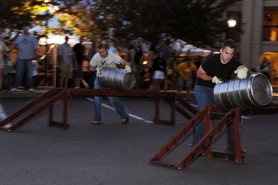 BARKSDALE AIR FORCE BASE, La. -- Barksdale personnel and their families participate in the keg-roll contest during Oktoberfest Oct. 1. The Barksdale Oktoberfest is based on the traditional German Oktoberfest, a 200 year-old festival held in Munich. (U.S. Air Force photo/Senior Airman Brittany Y. Bateman)(RELEASED)