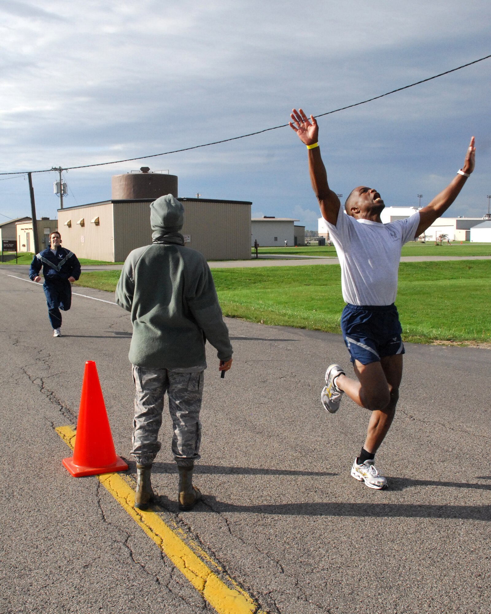 NIAGARA FALLS AIR RESERVE STATION, N.Y- Lt.Col. Pat Campell 914th OSS Chief of Tactics shows his enthusiasm as he crosses the finish line of the biannual PT 1 1/2 mile run recently held at the base.  New standards introduced help ensure that Air Force Reserve members are fit to fight.  (U.S. Air Force Reserve photo by Mr. Mike Harvey)