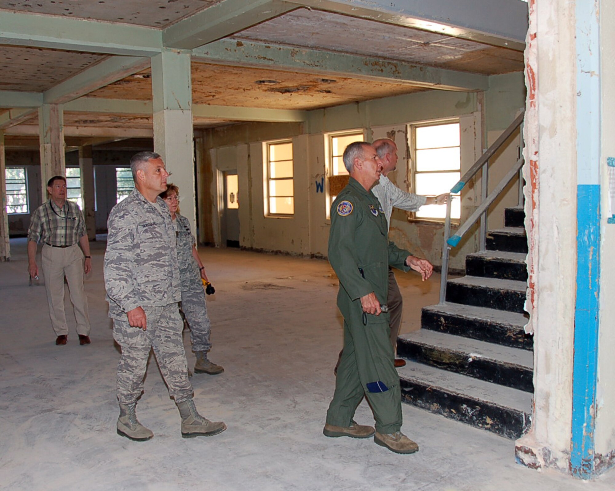 BARKSDALE AIR FORCE BASE, La. – Maj. Gen. Floyd Carpenter, Eighth Air Force commander, get s a tour of renovations going on inside Building 5354 from Darin Bailey, NAVFAC southeast resident engineer. The $25 million renovation project covers more than 77,000 square feet of office space and will transform the building built in 1934 into a 21st Century warfighting headquarters for Eighth Air Force. (U.S. Air Force photo by Maj. Richard Komurek)