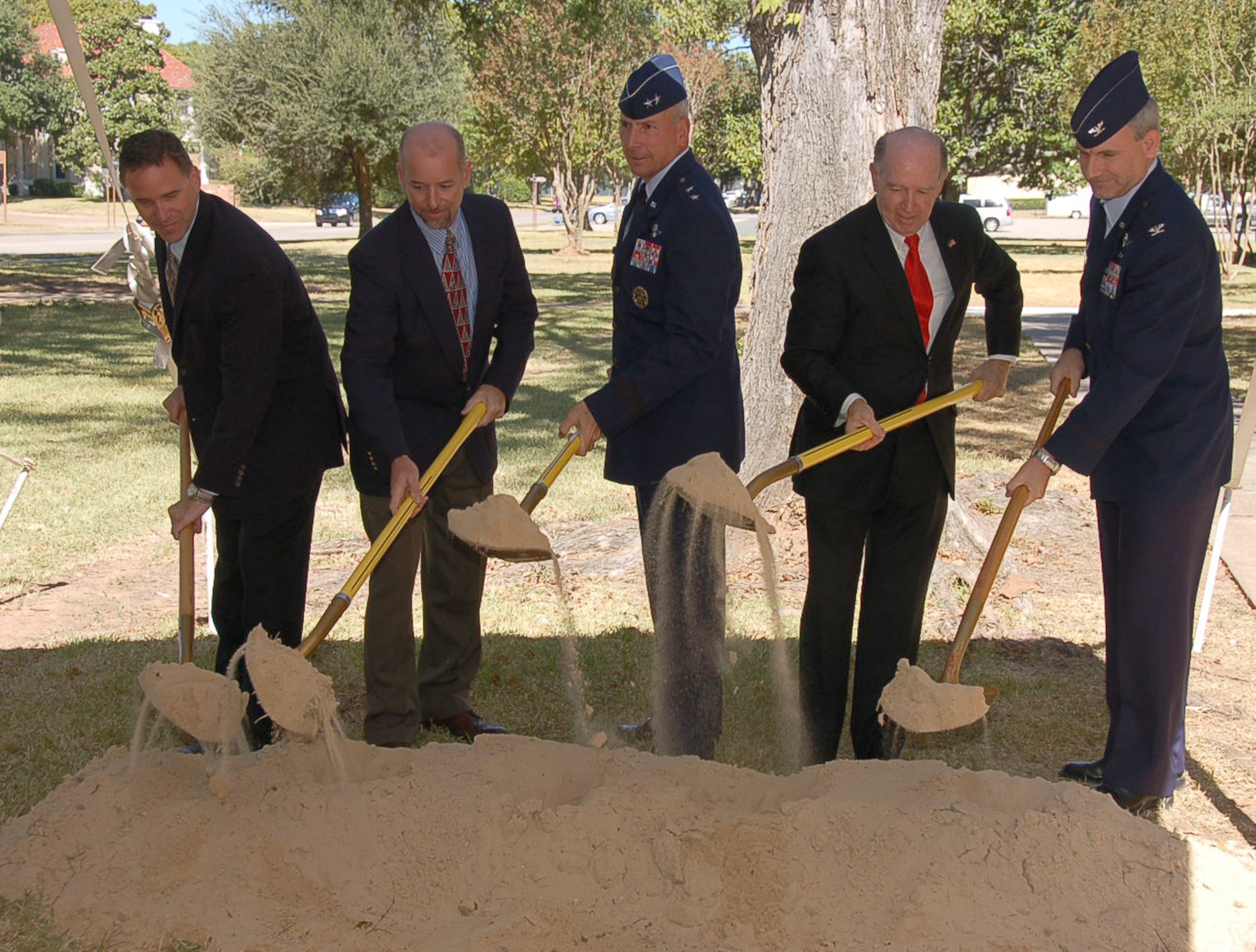 BARKSDALE AIR FORCE BASE, La. – Pat Cartwright, Sauer Inc. regional vice president; Darin Bailey, NAVFAC southeast resident engineer; Maj. Gen. Floyd Carpenter, Eighth Air Force commander; Mayor Lorenz Walker, Bossier City, La., mayor; and Col. Timothy Fay, 2nd Bomb Wing commander, shovel the ceremonial first mound of dirt signifying groundbreaking ceremony on the $25 million renovation to the new Eighth Air Force Headquarters building on Barksdale Air Force Base Oct. 4. The renovation project covers more than 77,000 square feet of office space. Once completed, the headquarters will be equipped with the modern, state-of-the-art communications and information security systems needed to support one of our nation’s most important missions – the mission of nuclear deterrence and global strike operations. (U.S. Air Force photo by Staff Sgt. Brian Stives)