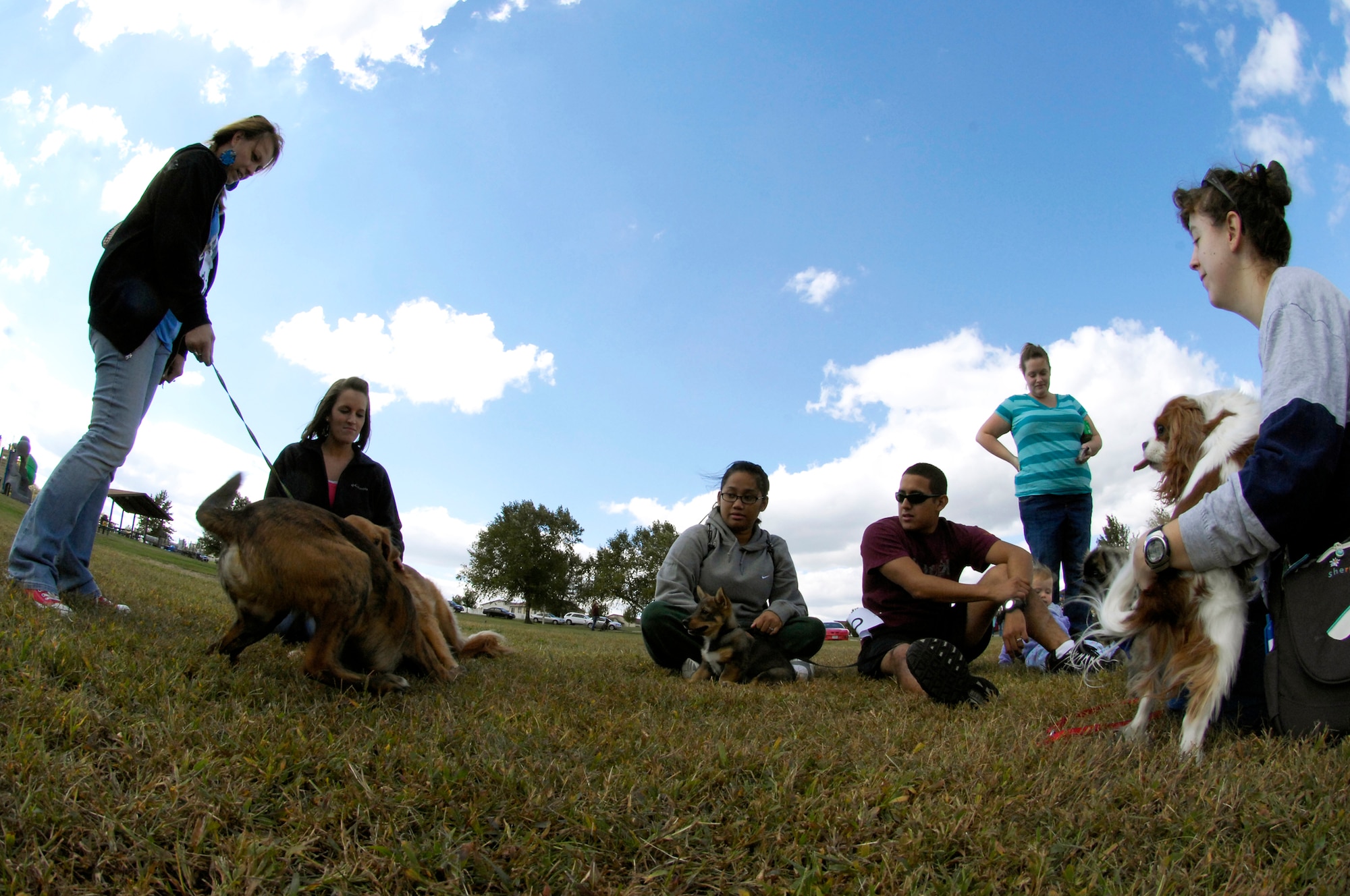 WHITEMAN AIR FORCE BASE, Mo. - Participants in the 2010 Whiteman Bark in the Park hang out Oct. 2 prior to the start of the event. The annual event was hosted by the Whiteman Community Activities Center and Vet Clinic and is part of the Air Force Global Strike Command values for Airmen moral and welfare. (U.S. Air Force photo/Senior Airman Jason Barebo)