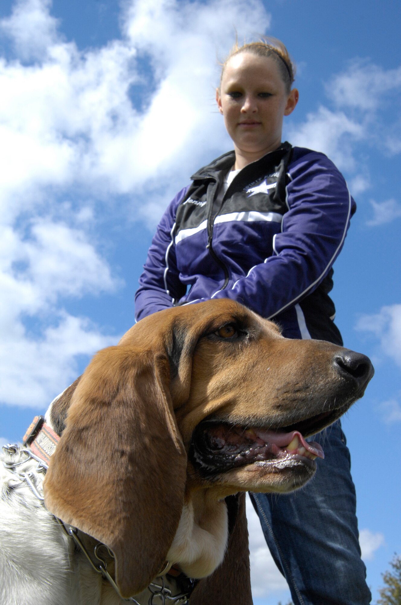 WHITEMAN AIR FORCE BASE, Mo. - Sam, a basset hound, stands with his owner, Jenny Hanson, Oct. 2, as they wait to register for the 2010 Whiteman Bark in the Park at Ike Skelton Park. The annual event was hosted by the Whiteman Community Activities Center and Vet Clinic and is part of the Air Force Global Strike Command values for Airmen moral and welfare. (U.S. Air Force photo/Senior Airman Jason Barebo)