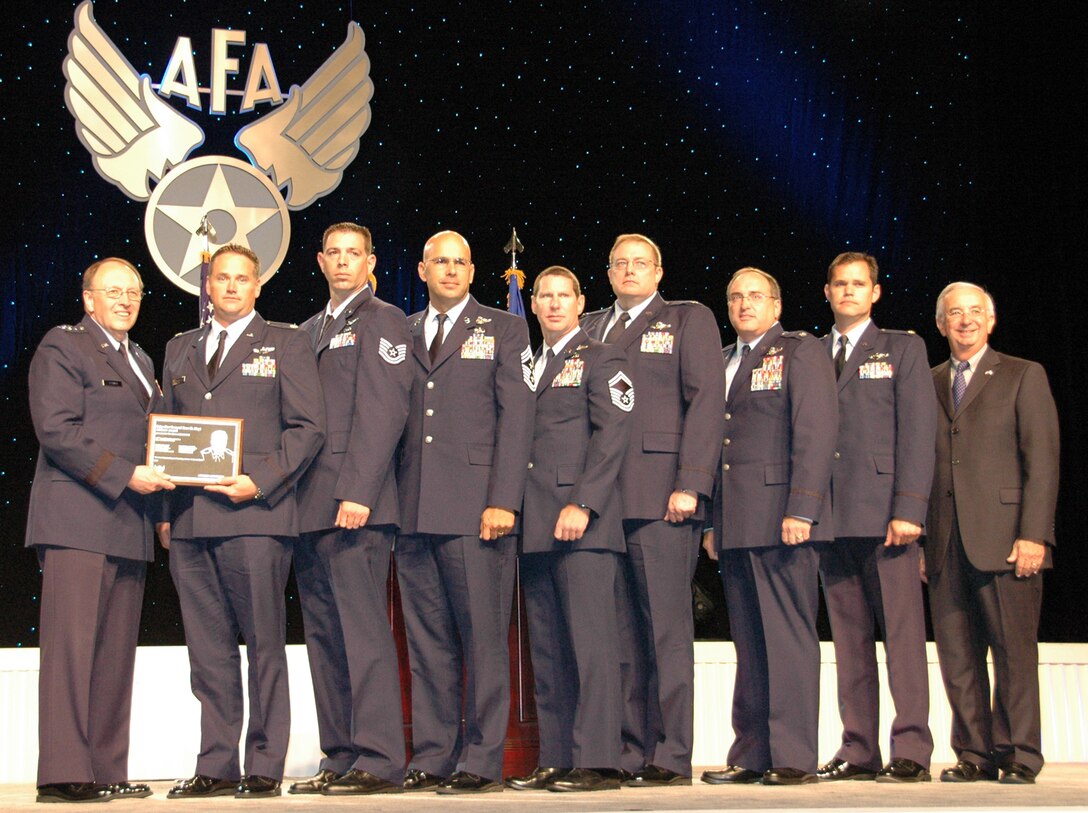 From left:  Lt. Gen. Charles E. Stenner Jr., commander of the Air Force Reserve Command and chief of the Air Force Reserve, is shown with “Daddy 05” aircrew members:  Maj. Michael Black; Tech. Sgt. Ronald Bacon; Chief Master Sgt. Michael Klausutis; Senior Master Sgt. Keith Poole; Lt. Cols. Thomas Mims and Christopher Snider; Maj. John Stone II; along with Joseph Sutter, Air Force Association chairman of the board at the annual AFA awards ceremony at National Harbor, Md. in September. The Duke Field reservist aircrew members were presented the AFA's 2009 Brig. Gen. Ross G. Hoyt Award for the Air Force’s most outstanding air refueling crew.  The winning crew also included Col. Bruce Taylor and 1st Lt. Patrick Hobgood (not shown).  (U.S. Air Force photo/Dan Neely)