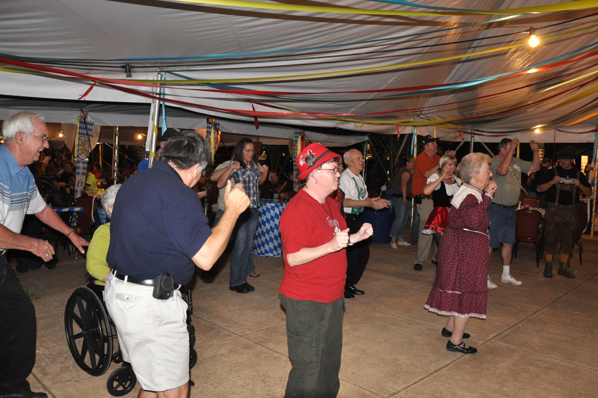 Dancing the night away, could have been the theme for the 3rd Annual Oktoberfest celebration at Barksdale Air Force Base, La., Oct. 1, 2010. For the price of admission partygoers enjoyed an authentic German meal, which included bratwurst, schnitzel, German potato salad, and a roll; along with 2 beverages and a commemorative Oktoberfest cup. Partygoers talked, ate, sang and danced, while some others participated in the keg rolling and a costume contest. (U.S. Air Force photo/Tech. Sgt. Jeff Walston)