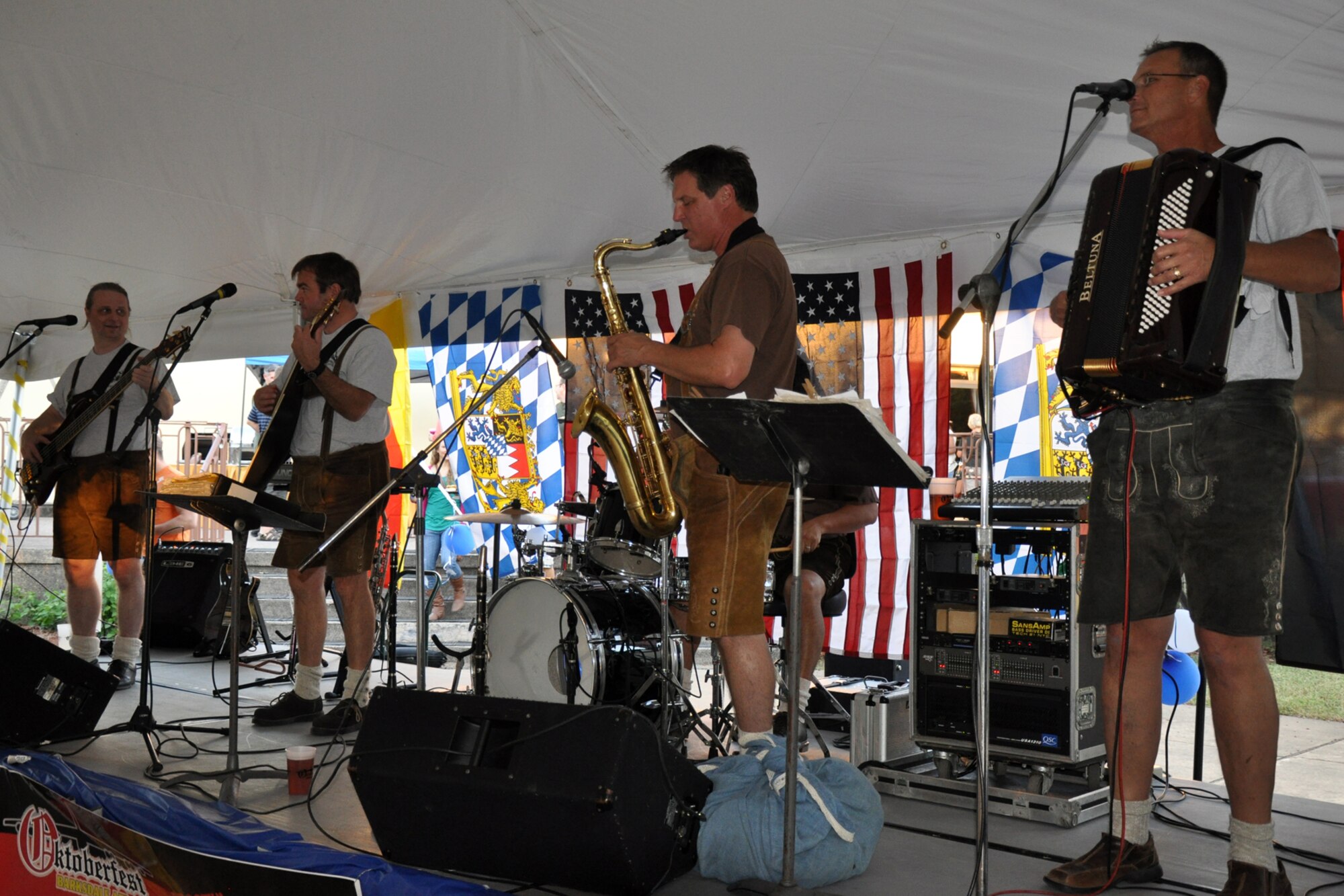The German Oompah band Alpenmusikieten perform for the the crowd at the 3rd Annual Oktoberfest celebration at Barksdale Air Force Base, La., Oct. 1, 2010. The price of admission included bratwurst, schnitzel, German potato salad, and a roll; along with 2 beverages and a commemorative Oktoberfest cup. Partygoers talked, ate, sang and danced, while others participated in the keg rolling and a costume contest. (U.S. Air Force photo/Tech. Sgt. Jeff Walston)