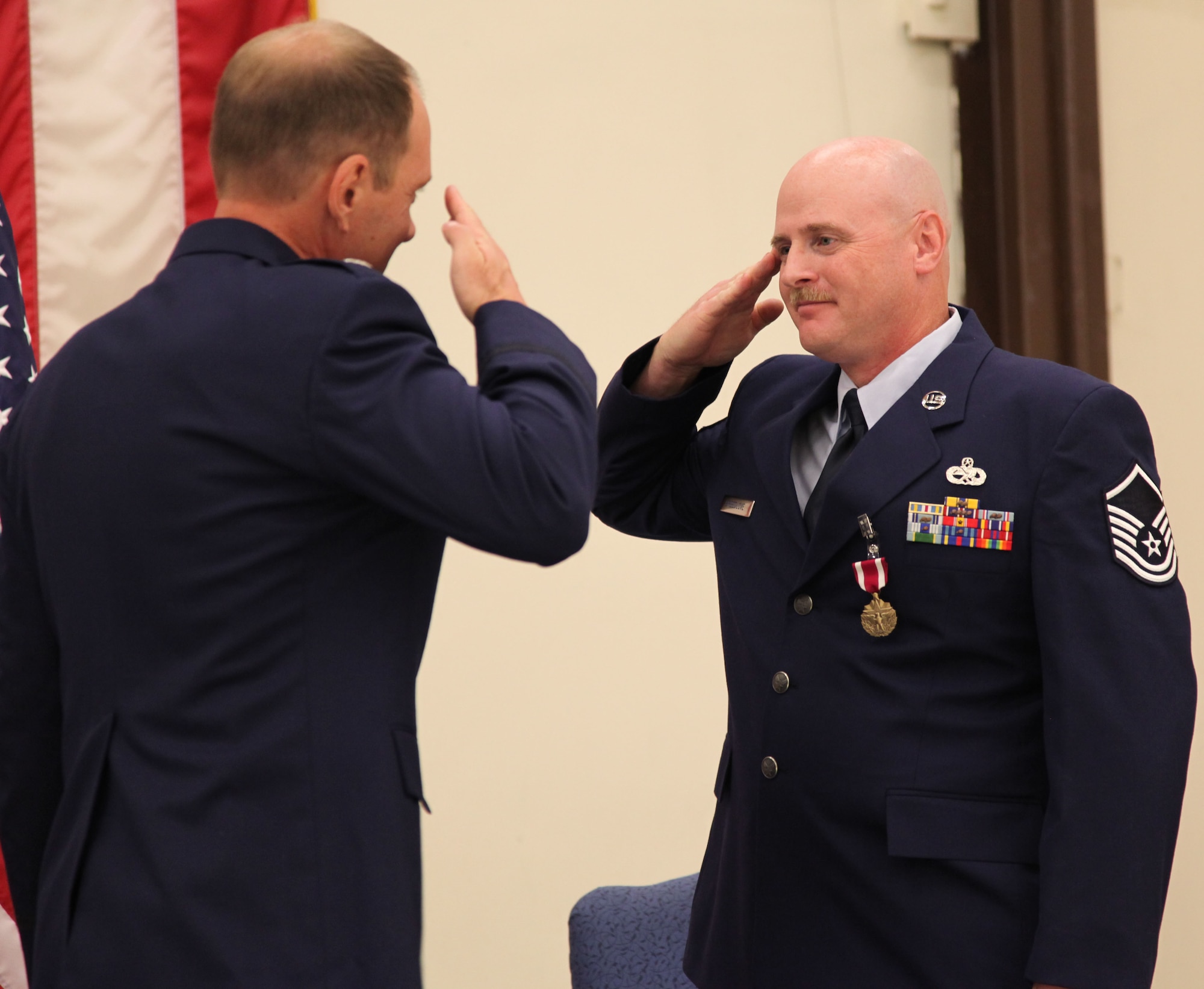 Master Sgt. Todd Breedlove salutes Lt. Col John Welch after receiving the Meritorious Service Medal at his retirement ceremony, Oct. 2, at Beale Air Force Base, Calif.. Breedlove retired after 21 years of service. The last 11 years were with the 940th Wing. (U.S. Air Force photo/Tech. Sgt. Kenneth McCann)