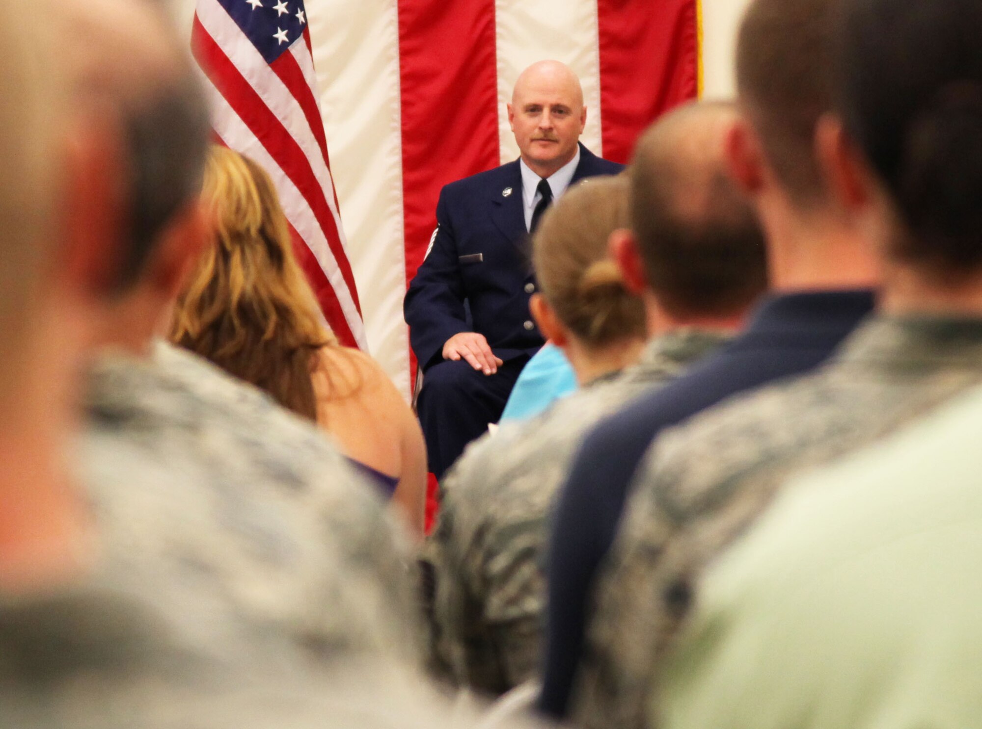 Master Sgt. Todd Breedlove looks out over the audience during his retirement ceremony.  Breedlove retired from the 13th Reconnaissance Squadron during a ceremony, Oct. 2. As a jet engine mechanic, he helped integrate the Global Hawk mission at the 940th Wing. He is retiring after 21 years of service. (U.S. Air Force photo/Tech. Sgt. Kenneth McCann)(U.S. Air Force photo/Tech Sgt. Kenneth McCann)