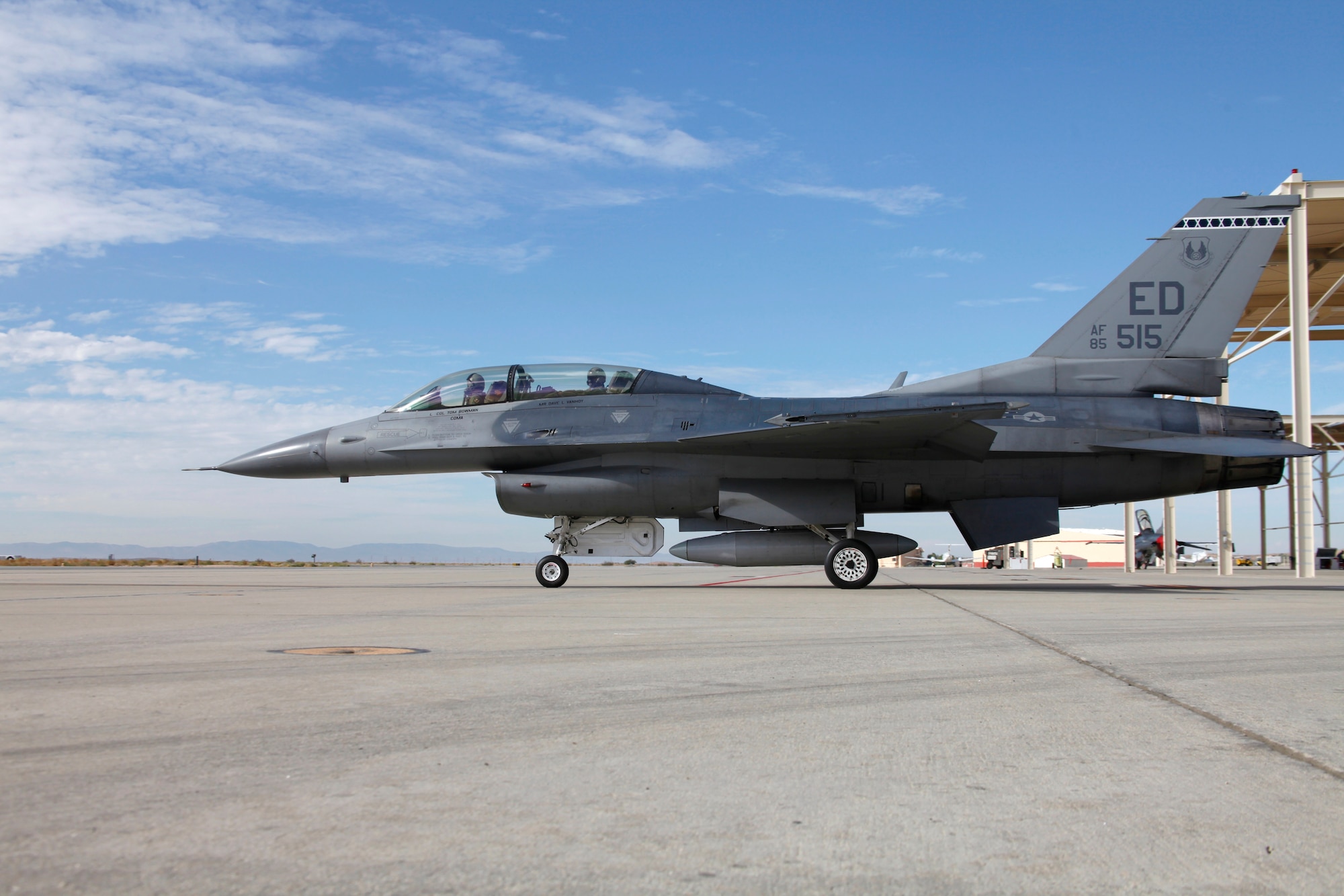 An F-16D, serial #85-0515, taxis from the parking area at Edwards for its final mission. This aircraft is the last standard Block 25 F-16 to be retired from use with the 412th Test Wing and was flown to Davis-Monthan Air Force Base, AZ, for retirement today. The pilot for the final flight was Maj. Andy Martin with Mr. Tim Kjonegaard, Flight Test Engineer, in the back seat. Both are assigned to the 445th Flight Test Squadron, Test Operations. Edwards AFB has operated Block 25 aircraft longer than any other Air Force base. Block 30, 40 and 50 F-16s have replaced the nearly 30-year-old Block 25 Fighting Falcons.  The retired fighters are generally modified and sold to foreign militaries or are dismantled for parts. (Air Force photo by Greg L. Davis) 