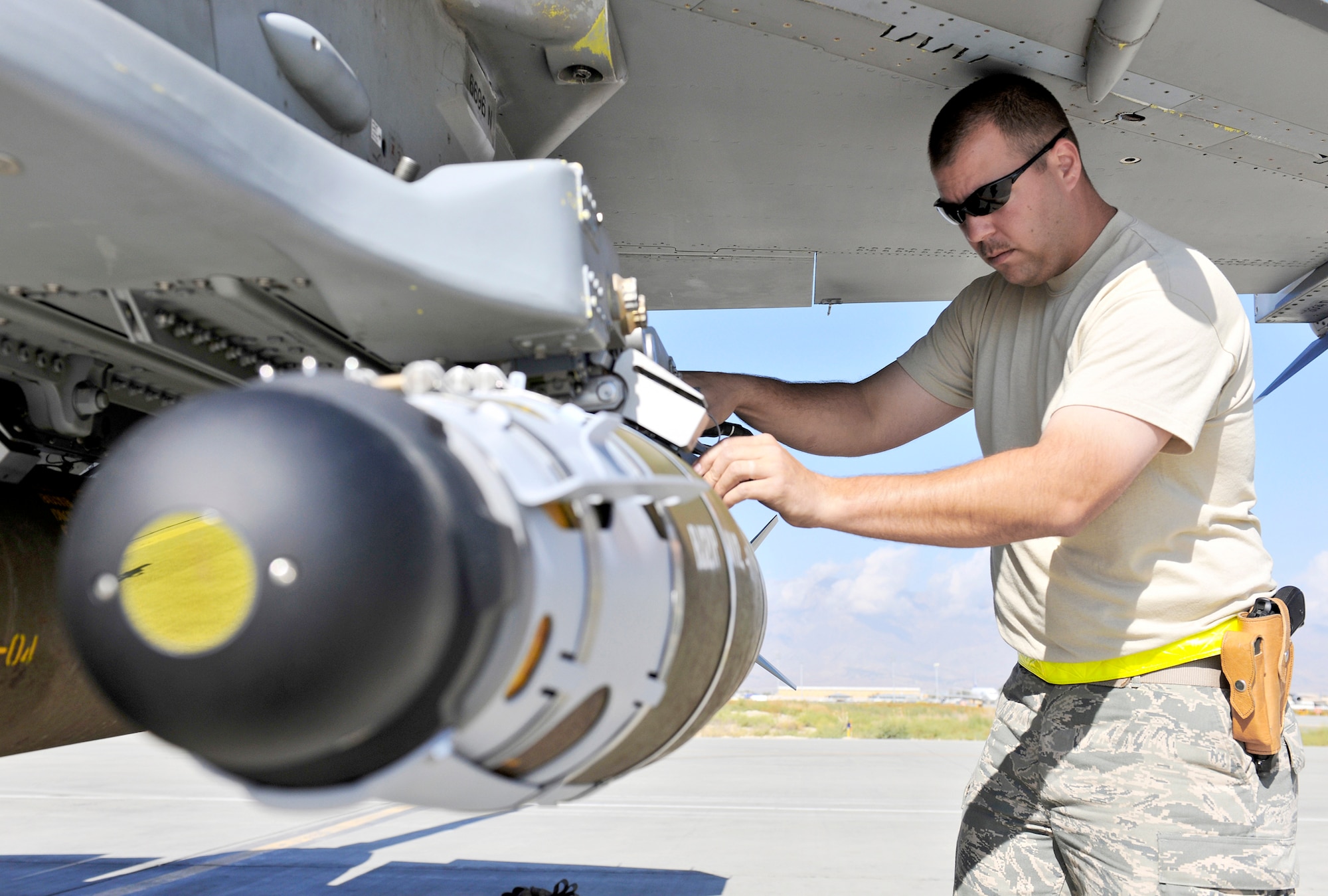 Tech Sgt. Darrin Sather performs a supervisory post load on a guided bomb unit-54 loaded on an F-16 Fighting Falcon Sept. 30, 2010, at Bagram Airfield, Afghanistan. The GBU-54 is the Air Force's newest 500-pound precision weapon, equipped with a special targeting system that uses a combination of Global Position System and laser guidance to accurately engage and destroy moving targets. Sergeant Sather is a weapons expeditor assigned to the 455th Expeditionary Aircraft Maintenance Squadron. (U.S. Air Force photo/Staff Sgt. Christopher Boitz)