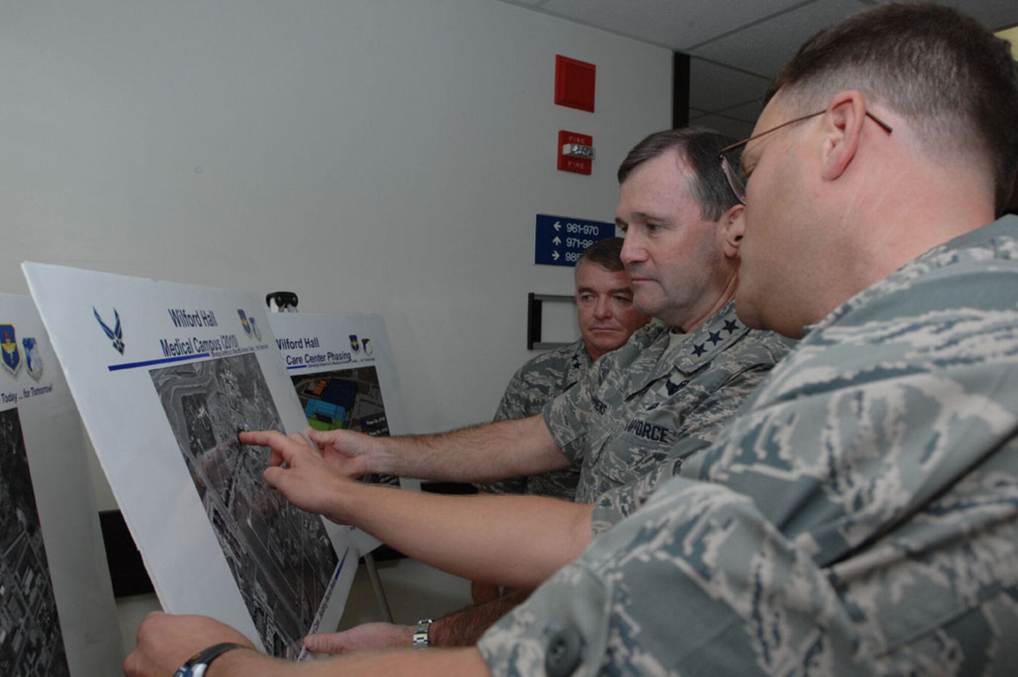 Lt. Col. Douglas Harper, Air Force Health Facilities Division, Joint Medical 
Facilities Office, (far right), briefs Lt. Gen. Douglas Owens, the new vice commander for the Air Education and Training Command, (center), and Maj. Gen. Tom Travis, 59th Medical Wing commander, Oct. 1, 2010, on future construction projects at Wilford Hall Medical Center, Lackland Air Force Base, Texas.  As the Air Force and Army comply with the 2005 Base Realignment and Closure plan, WHMC will convert to a large, jointly staffed and jointly led ambulatory surgical center. (U.S. Air Force photo by Staff Sgt. Robert Barnett)
