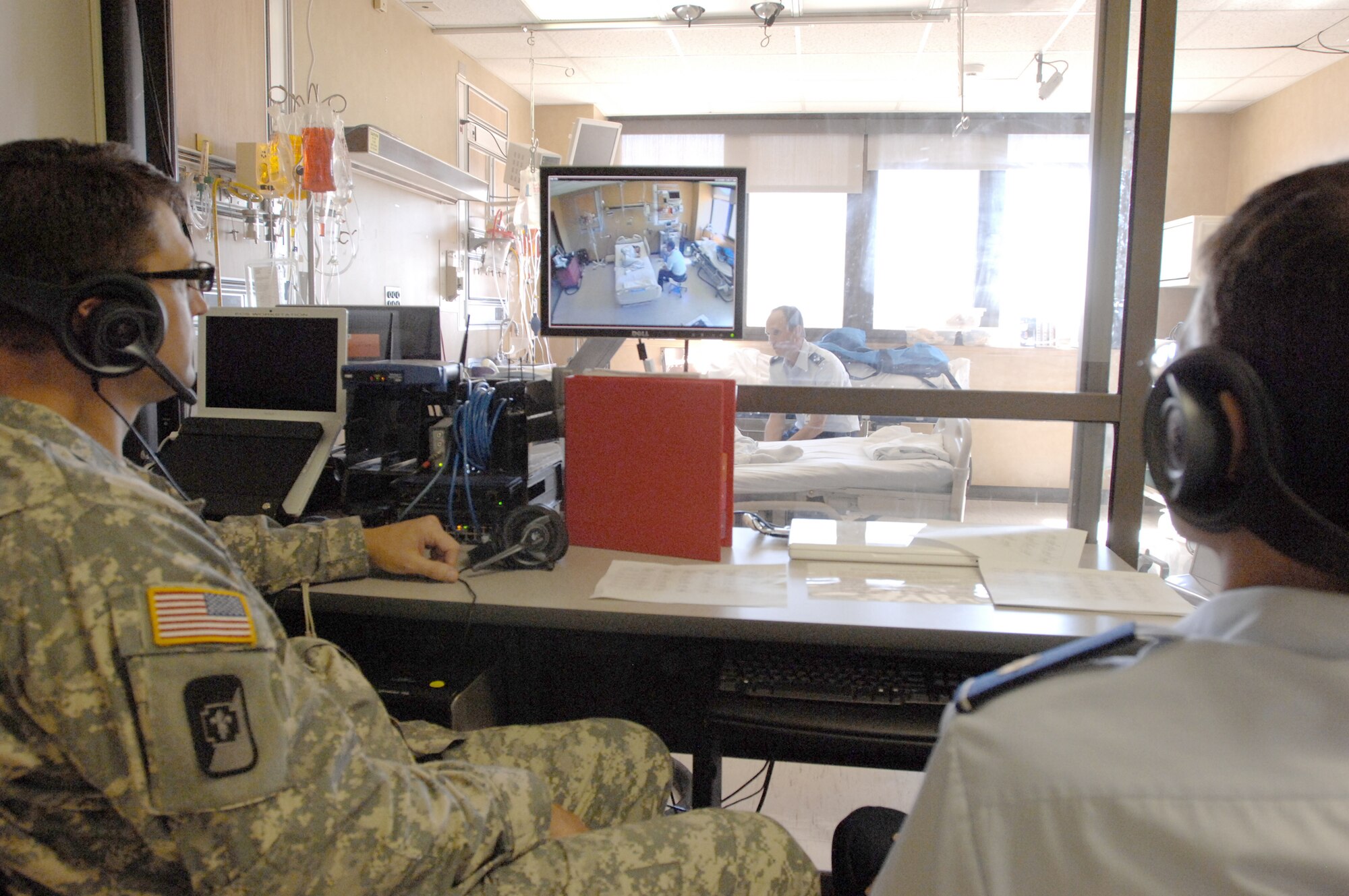 Military physicians observe a training session during a program director development course Sept. 28, 2010, at Wilford Hall Medical Center, at Lackland Air Force Base, Texas. The course, designed to train program directors for the Graduate Medical Education program, is run by the Uniformed Services University of the Health Sciences. (U.S. Air Force photo/Staff Sgt. Robert Barnett)