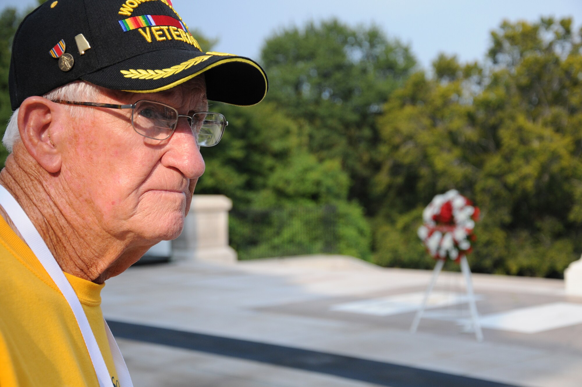 ARLINGTON NATIONAL CEMETERY, Va. -- Bill Summersgill, a WWII U.S. Marines corporal, watches the Changing of the Guard cermony at the Tomb of the Unknown Soldier here Sept. 22.  Veterans like Mr. Summersgill were able to tour the cemetery and Washington, DC, memorials through a free service provided by the Honor Flight Network, which is primarily supported by donations and volunteer efforts. (U.S. Air Force photo/Tech. Sgt. Steve Lewis)