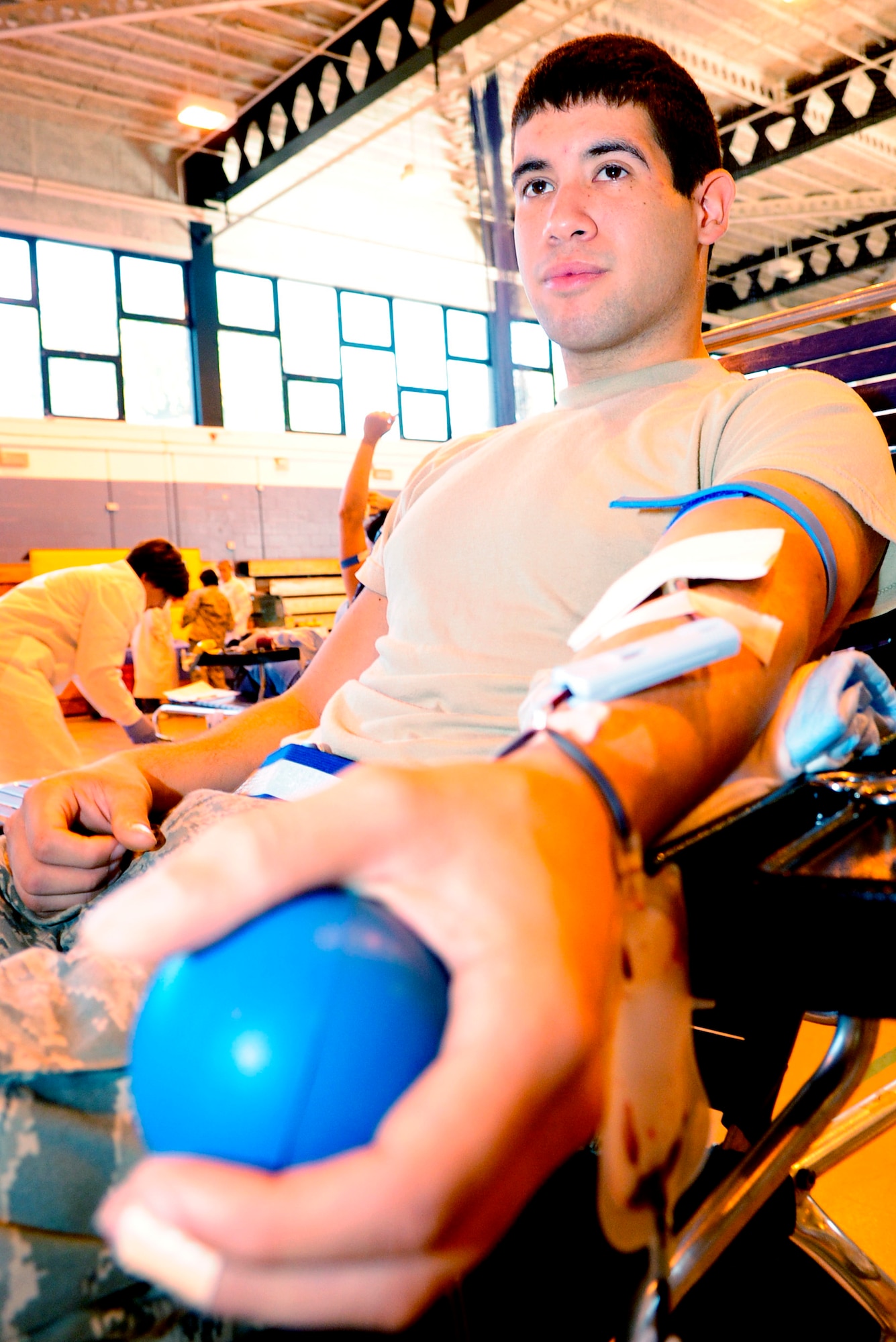 RAF MILDENHALL, England -- Airman 1st Class Donovan Ortiz, 100th Logistics Readiness Squadron, donates blood at the blood drive here Sept. 30.  The blood drive was held as part of the Armed Services Blood Program. (U.S. Air Force photo/Senior Airman Ethan Morgan)