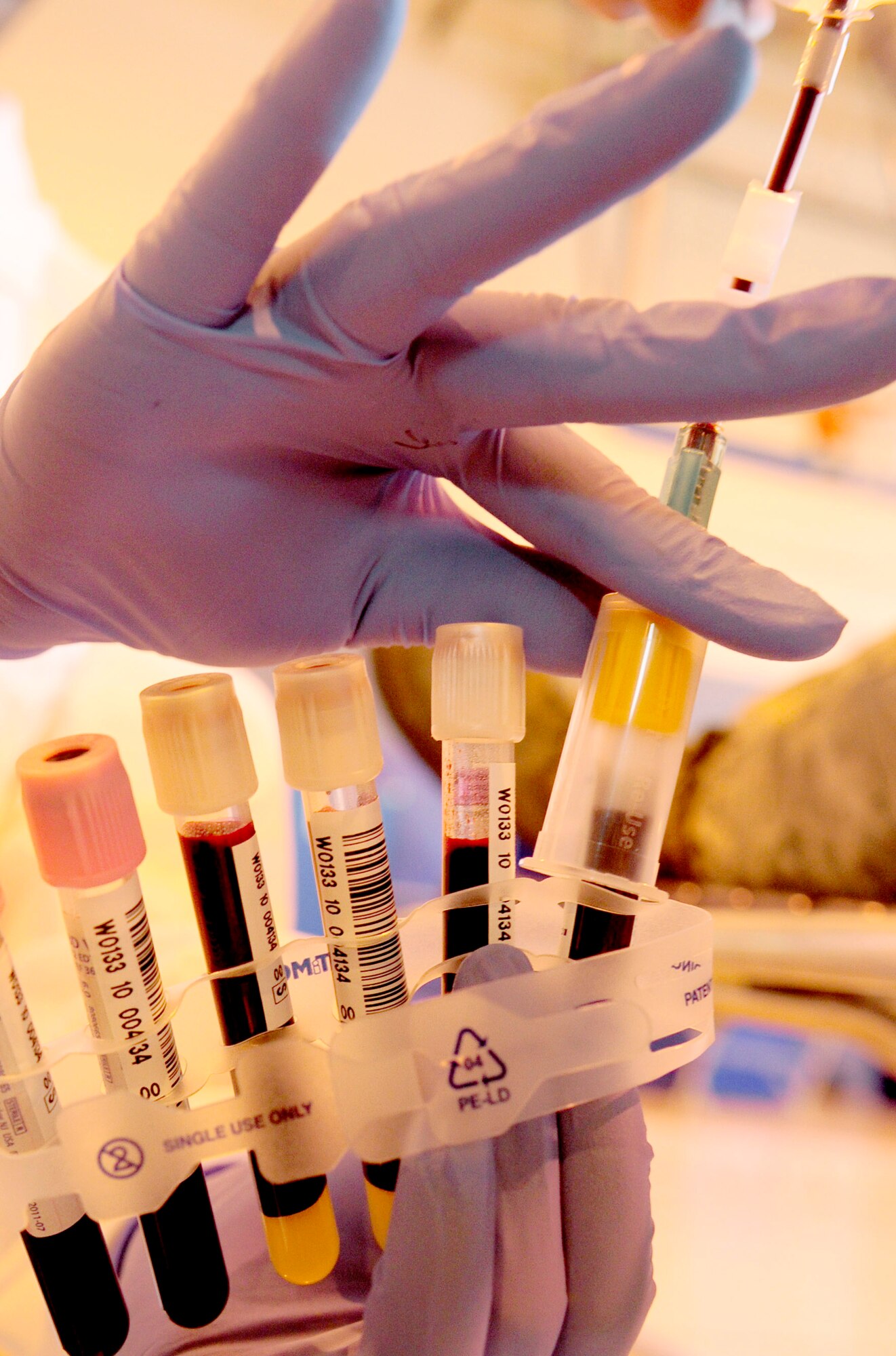 RAF MILDENHALL, England -- A medical lab technician fills the last vial in a set at the blood drive held here Sept. 30. Multiple vials are filled with blood from each person donating to allow for all necessary tests and screening to be done before the donation can be deemed useable. (U.S. Air Force photo/Senior Airman Ethan Morgan)