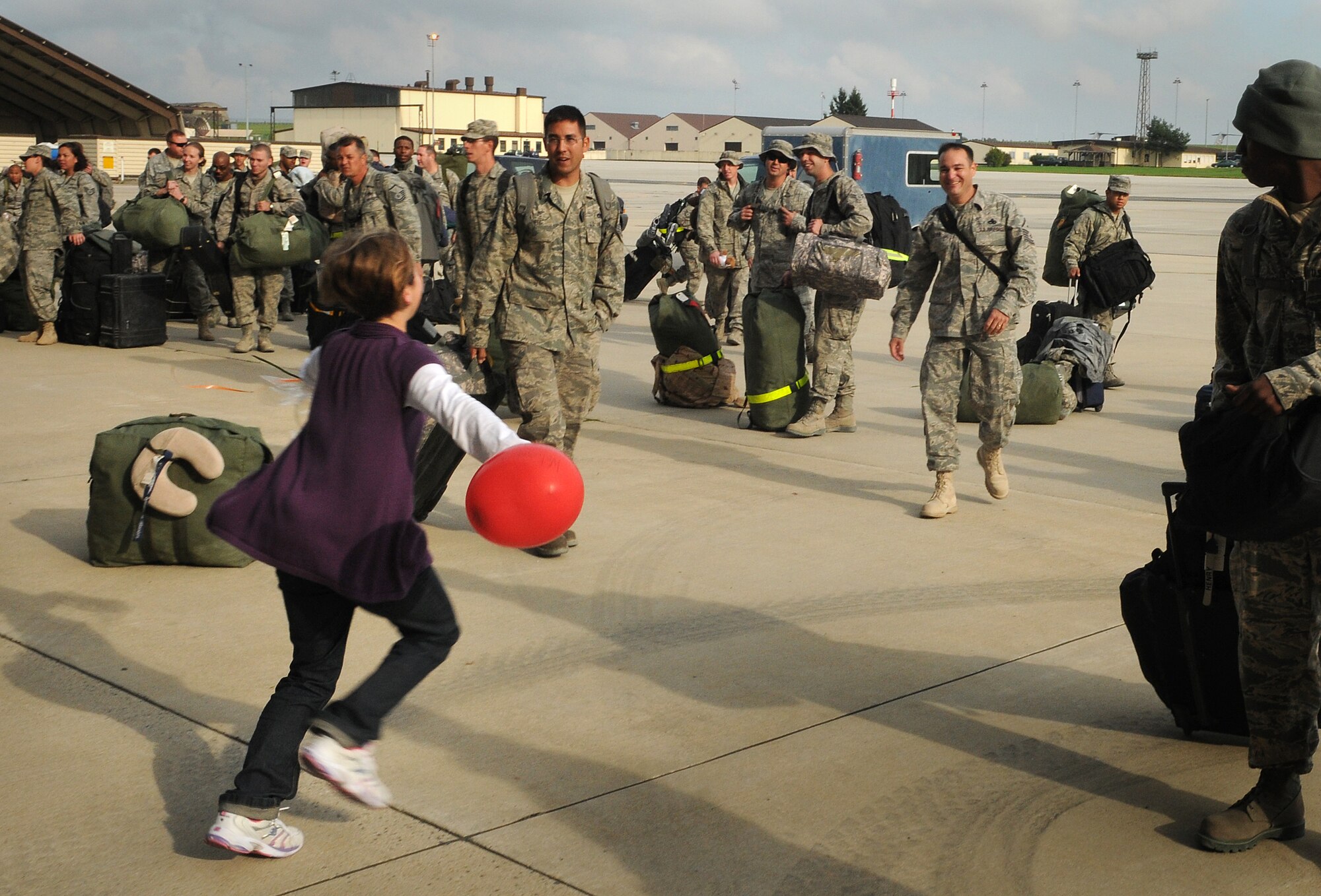 SPANGDAHLEM AIR BASE, Germany – A little girl runs to greet her father as he returns from a five-month deployment Oct. 1. The returning Airmen were deployed to Kandahar, Afghanistan, in support of the 81st Fighter Squadron. (U.S. Air Force photo/Staff Sgt. Benjamin Wilson)