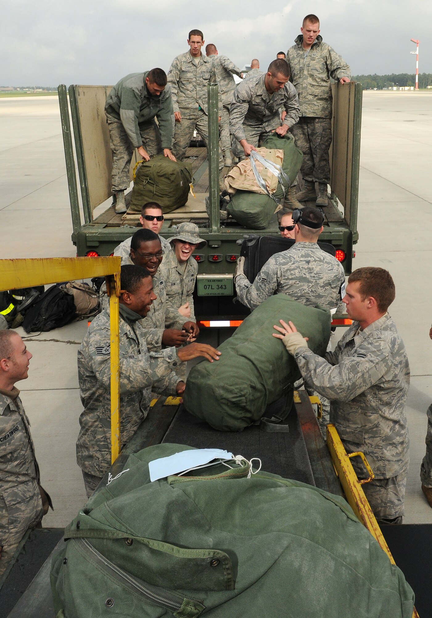 SPANGDAHLEM AIR BASE, Germany – A baggage team removes luggage from an unloading ramp Oct 1 after returning from a deployment in support of the 81st Fighter Squadron. The Airmen completed a five-month deployment to Kandahar, Afghanistan. (U.S. Air Force photo/Staff Sgt. Benjamin Wilson)